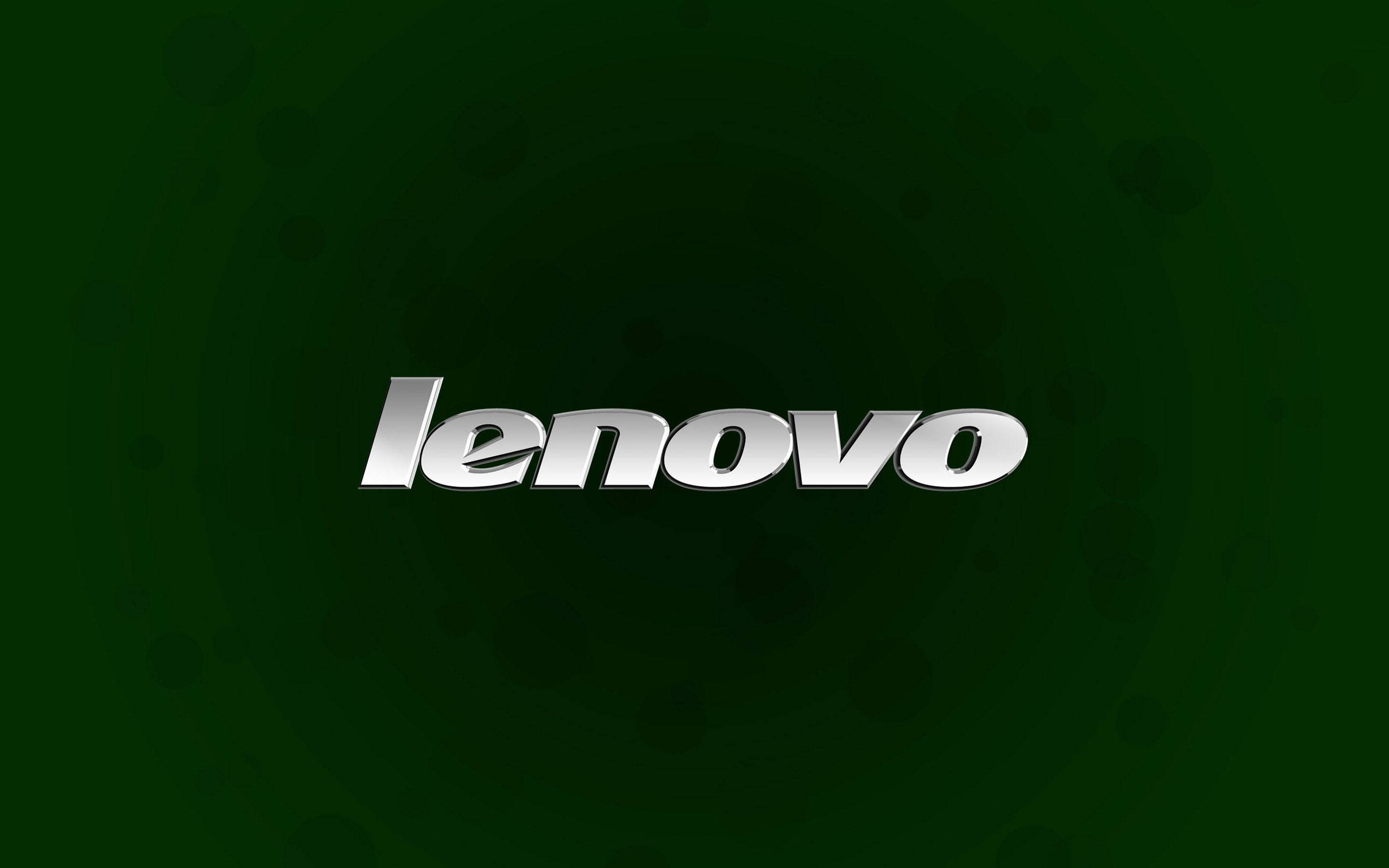 簡約綠色 Lenovo 官方壁紙 壁紙 — 閃亮銀色 Lenovo 標誌置中於深綠色漸變背景上，帶有微妙的圓形圖案。