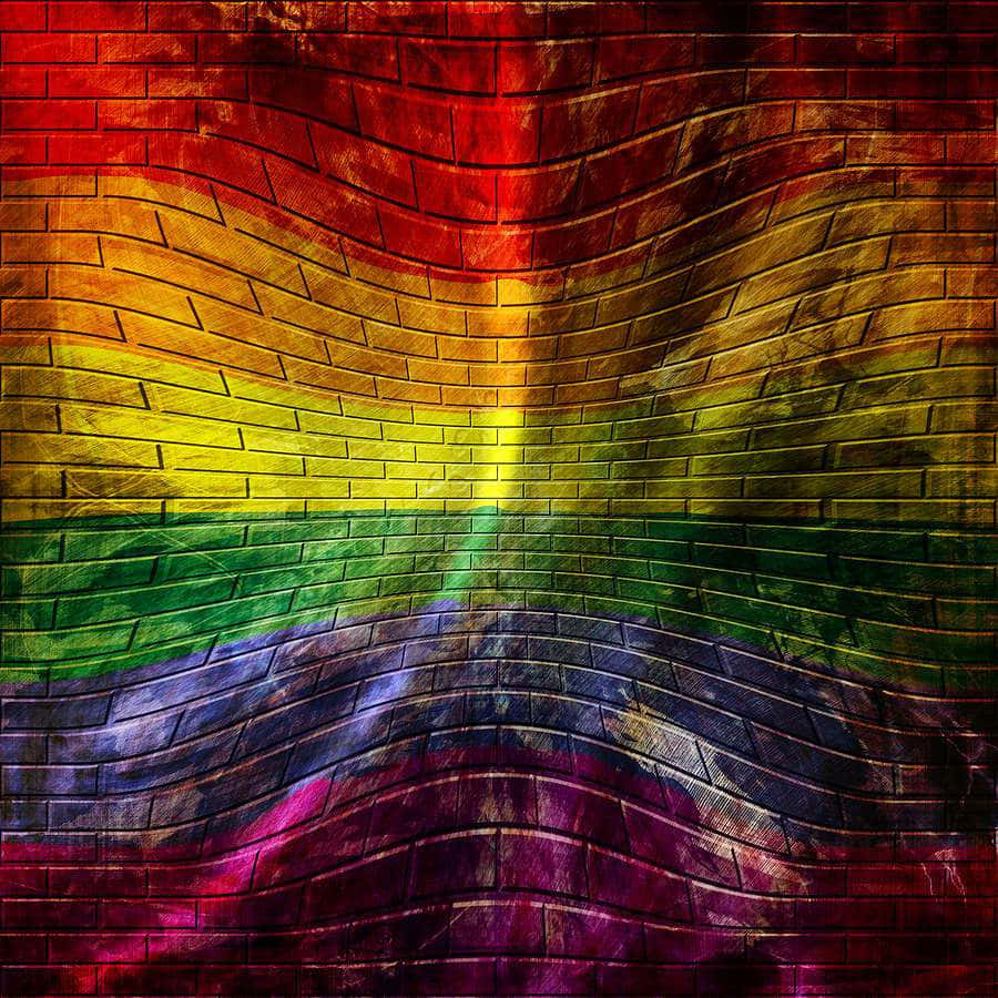 慶祝LGBT社群的多元性 壁紙 — 一幅充滿活力的彩虹旗繪在帶有紋理的磚牆上，採用波浪形對稱設計。