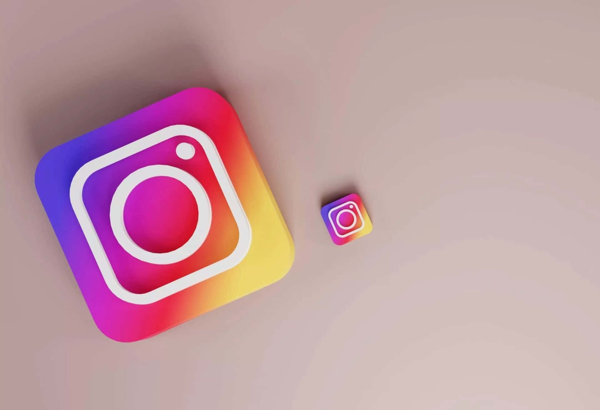  壁紙 — 兩個漸變 Instagram 應用程式圖示，一大一小，放在柔軟的米色表面上，投射出微妙的陰影。