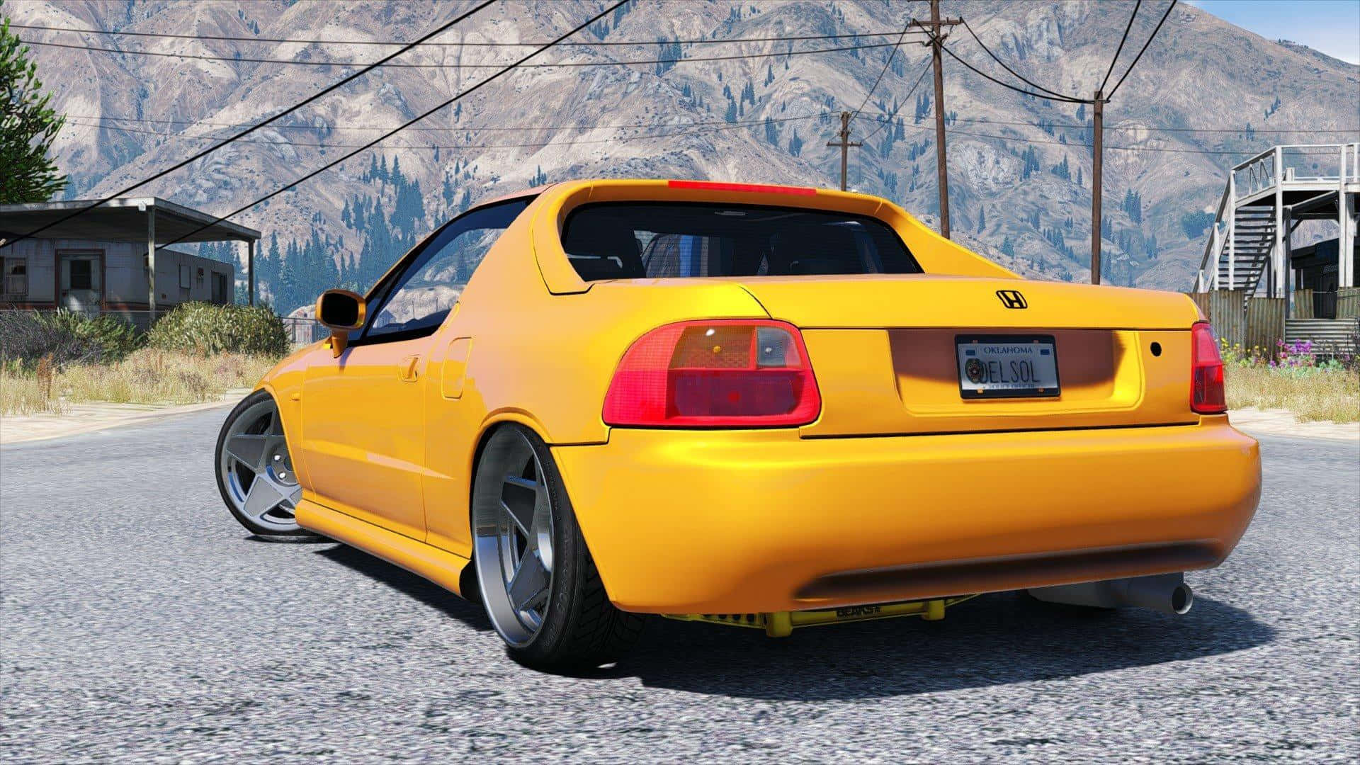 Honda Civic Del Sol 桌布 壁紙 — 一輛亮黃色的本田 Del Sol 跑車停泊在碎石路上，背景有山脈和電線。