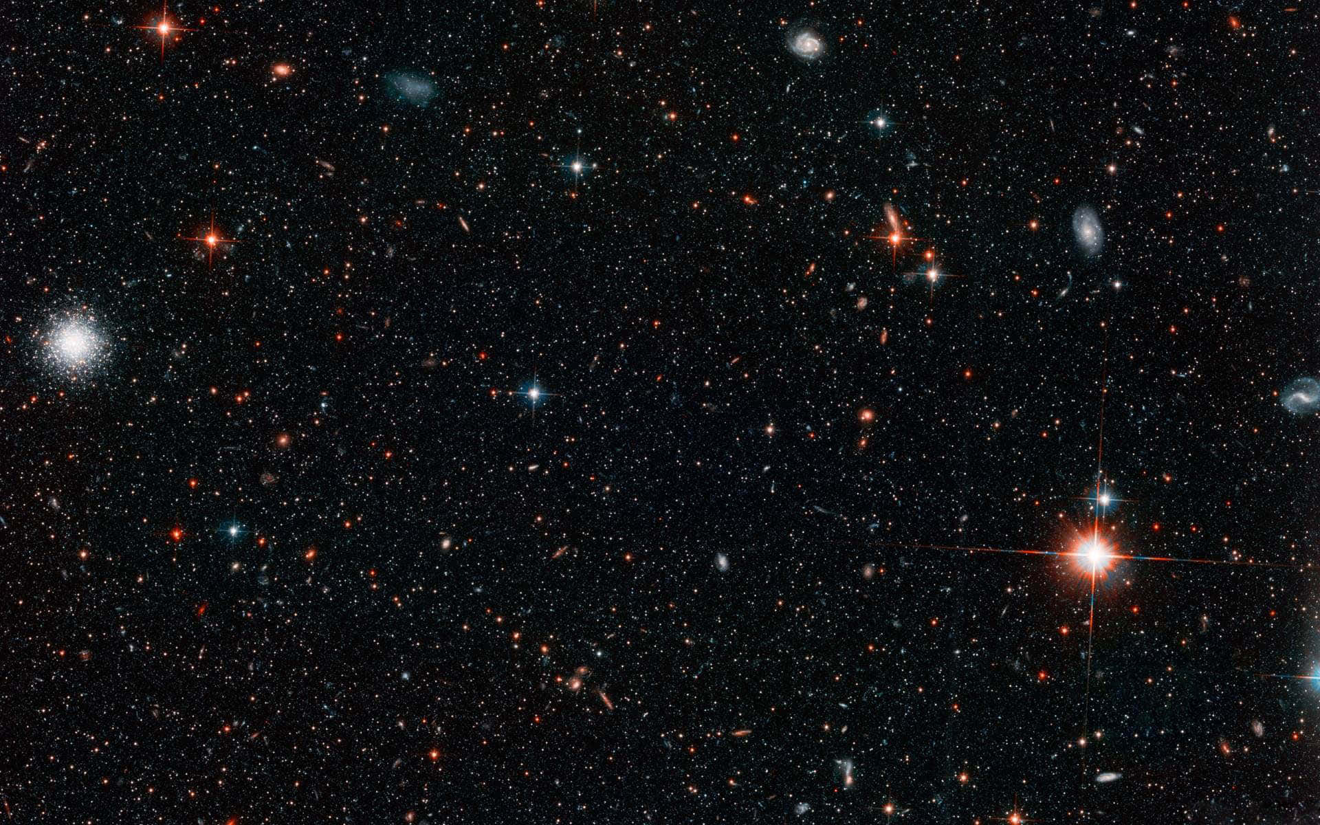 廣闊的宇宙場景，星星和星系散落在黑暗的宇宙中。