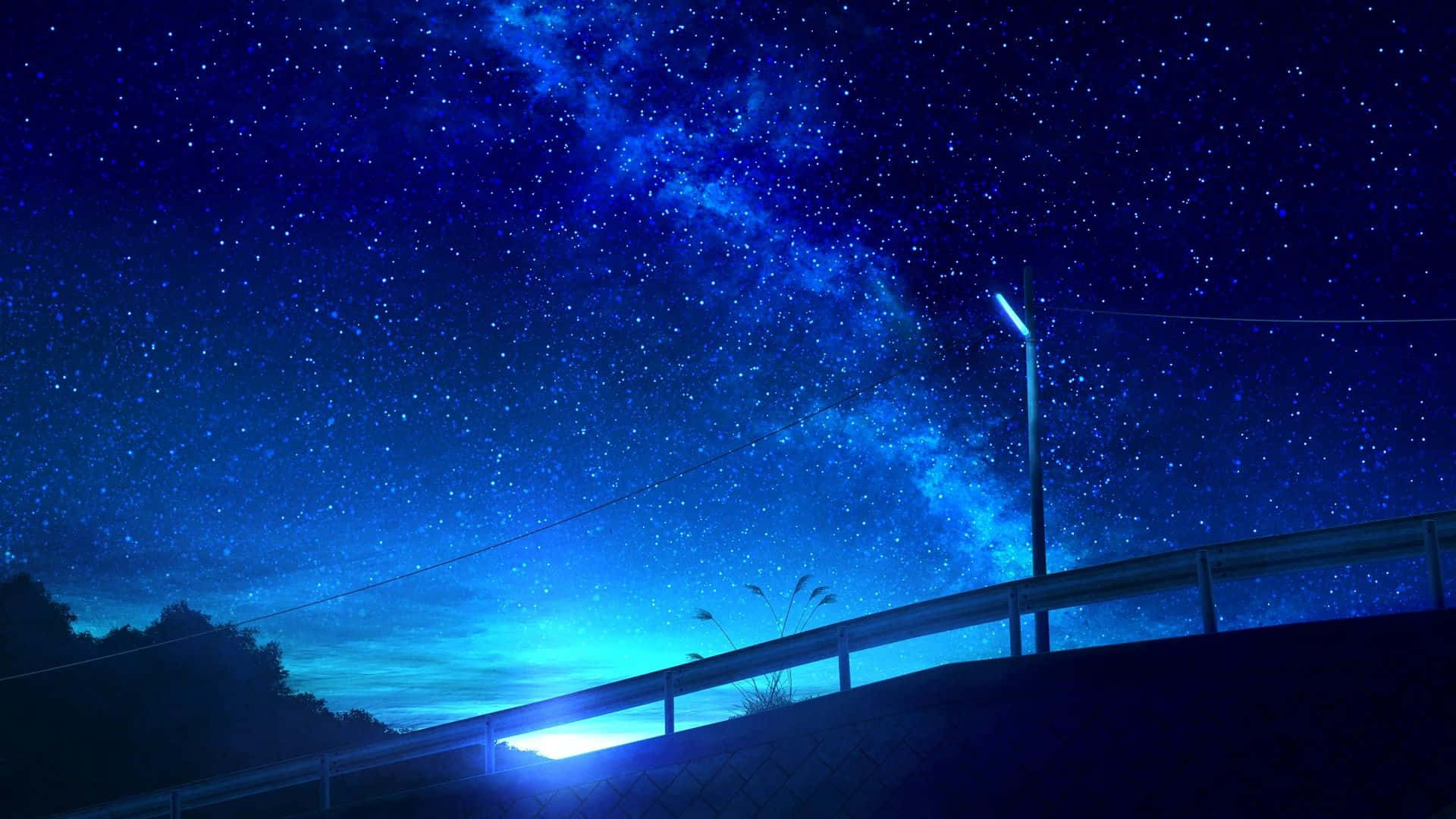  壁紙 — 令人嘆為觀止的夜空，佈滿繁星，銀河拱跨路邊護欄和街燈。