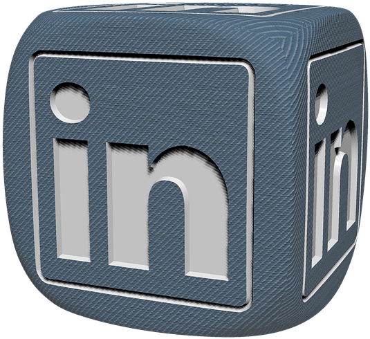 LinkedIn標誌骰子 壁紙 — 一個3D渲染的藍色立方體，其面上浮雕有LinkedIn標誌，背景為黑色。