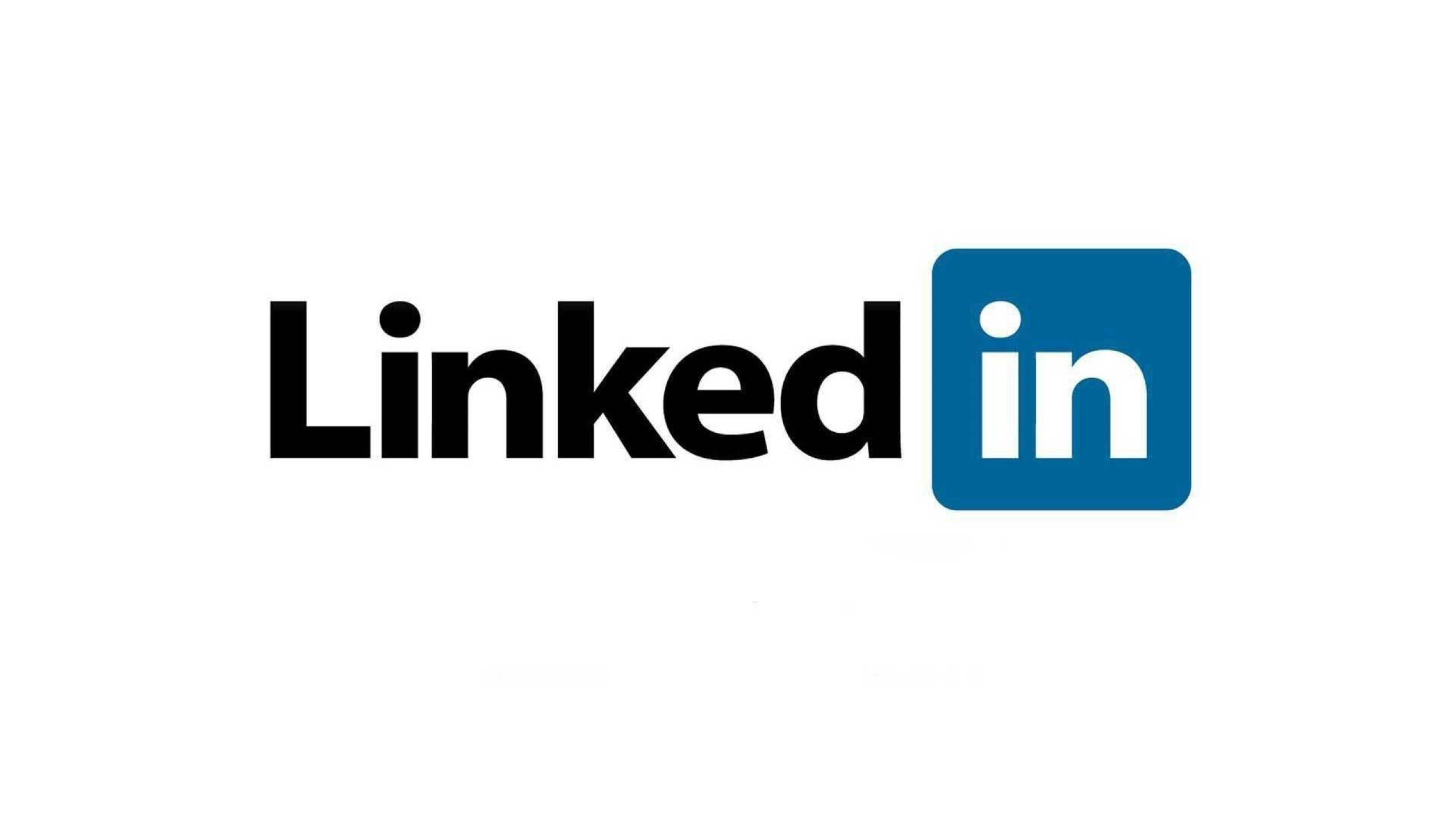 LinkedIn 原始標誌 壁紙 — LinkedIn 標誌以粗體黑色文字和藍色方形圖標呈現，背景為純白色。