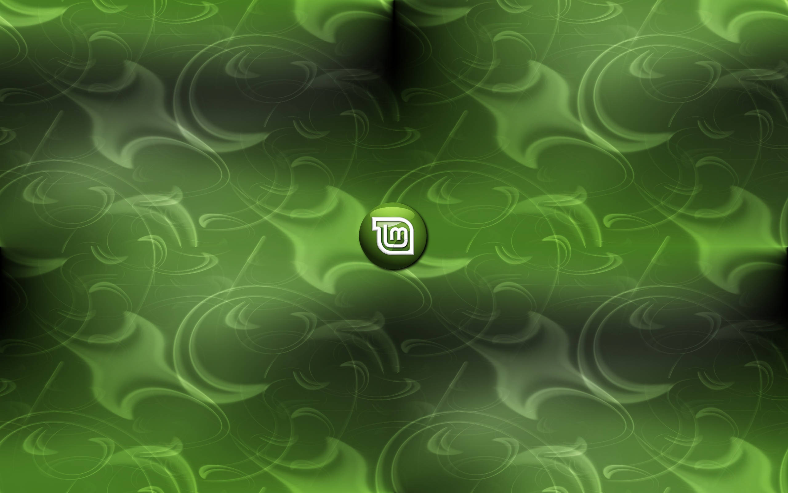 Linux Mint 操作系統 Logo 抽象漩渦 壁紙 — 一個旋轉的綠色抽象圖案，中心有一個發光的標誌。