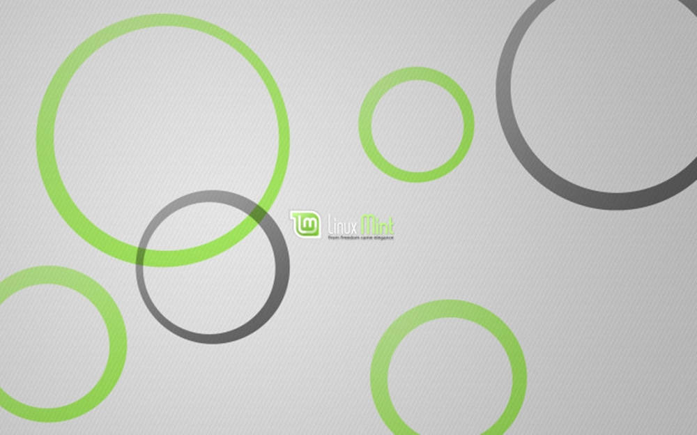 Linux Mint 操作系統標誌搭配圓圈圖案 壁紙 — 極簡風格壁紙，紋理灰色背景上重疊的綠色和灰色圓圈，帶有 Linux Mint 標誌。