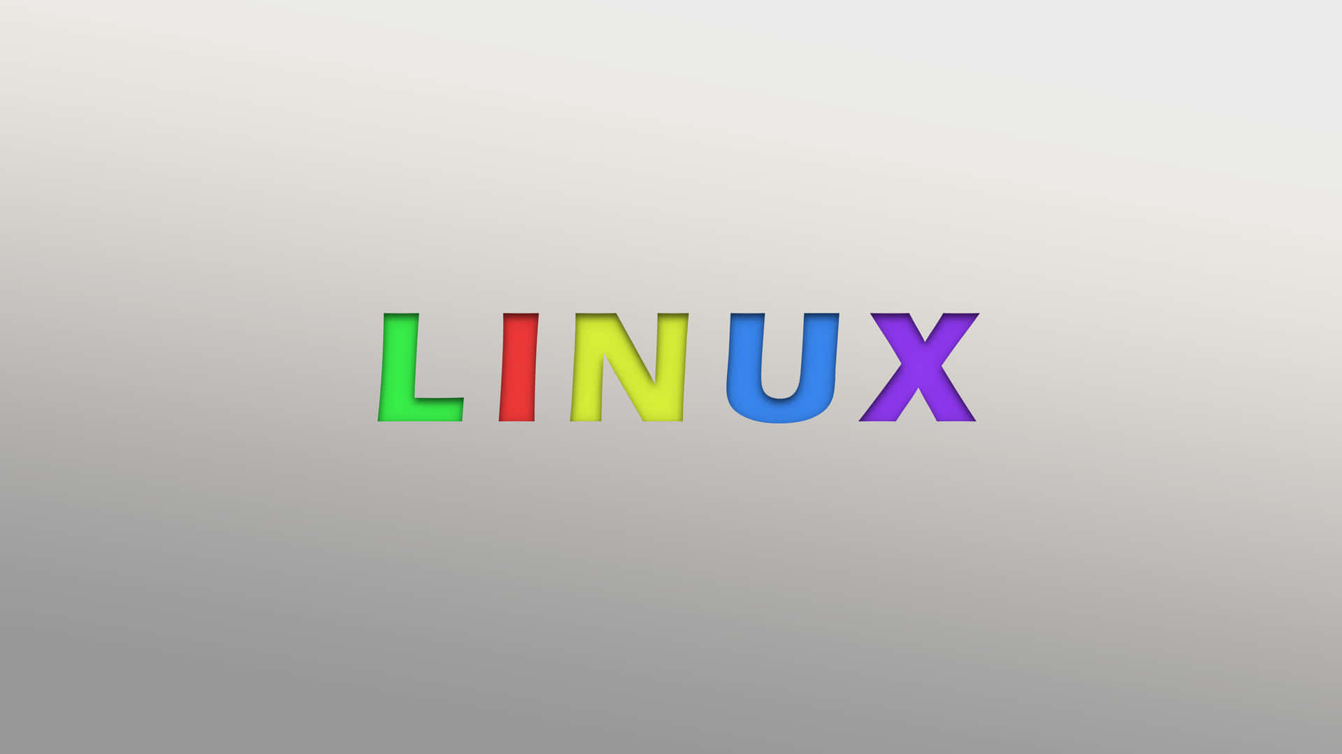 灰色漸變背景上的彩虹色 Linux 文字。