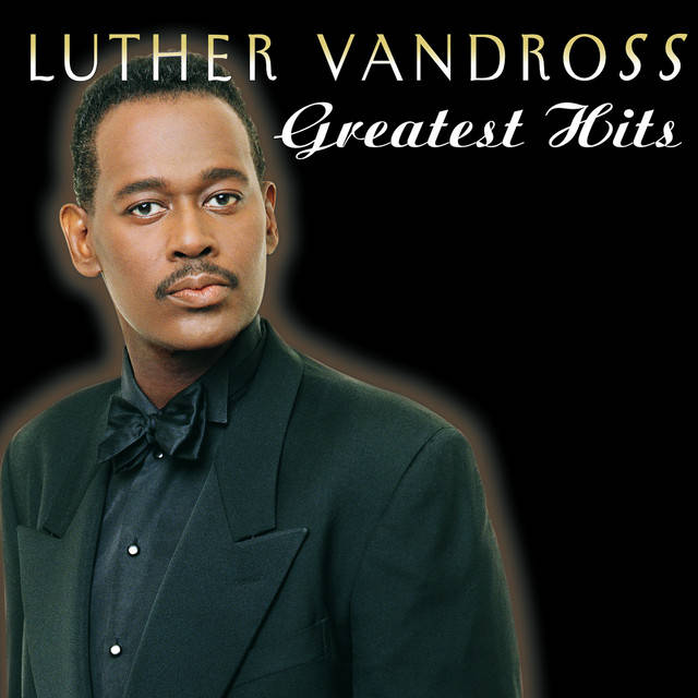 Luther Vandross 穿著正式服裝在音樂專輯封面上。