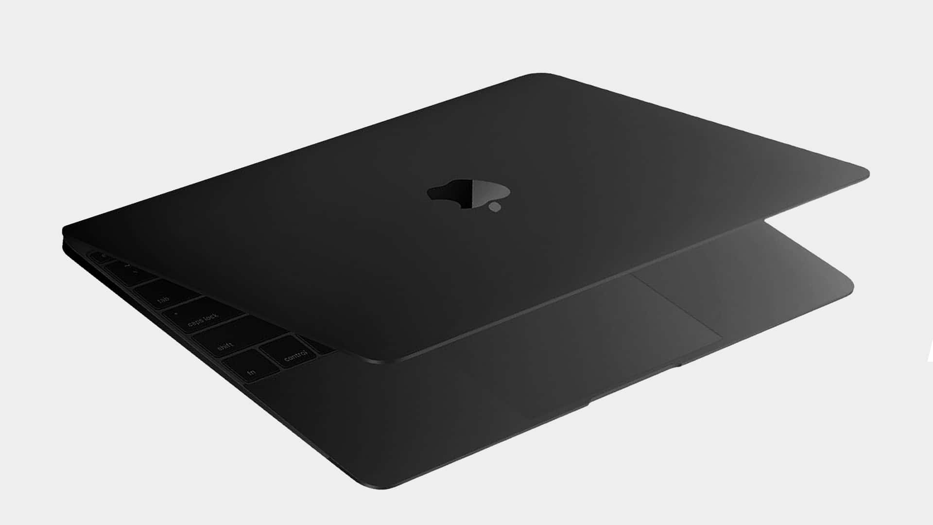 時尚優雅的黑色MacBook 壁紙 — 一部時尚的黑色手提電腦，採用極簡設計，在純色背景上可見鍵盤按鍵。