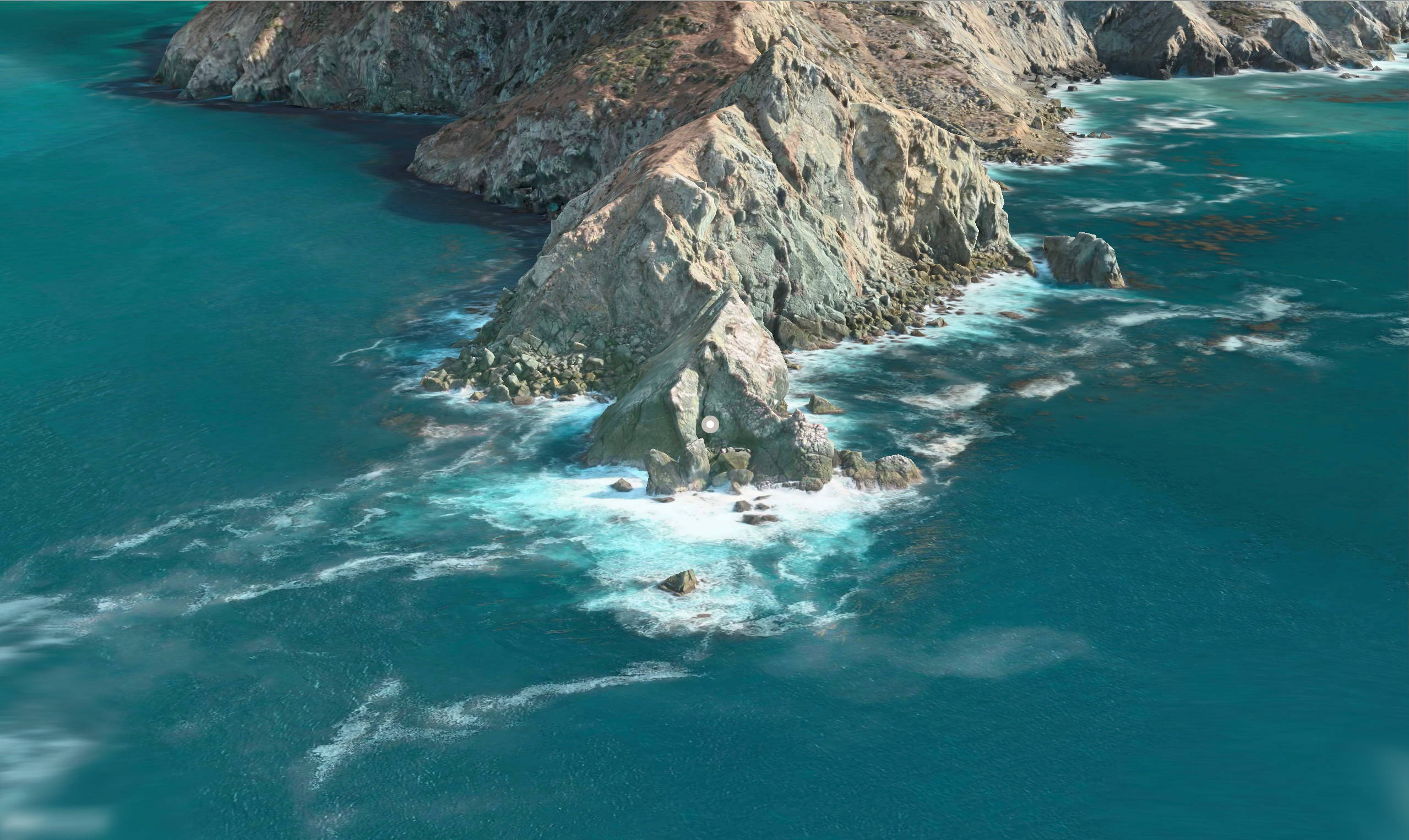 macOS Catalina 島嶼 壁紙 — 崎嶇懸崖突出於充滿活力的碧綠海洋，海浪拍打，白色泡沫翻騰的鳥瞰圖。