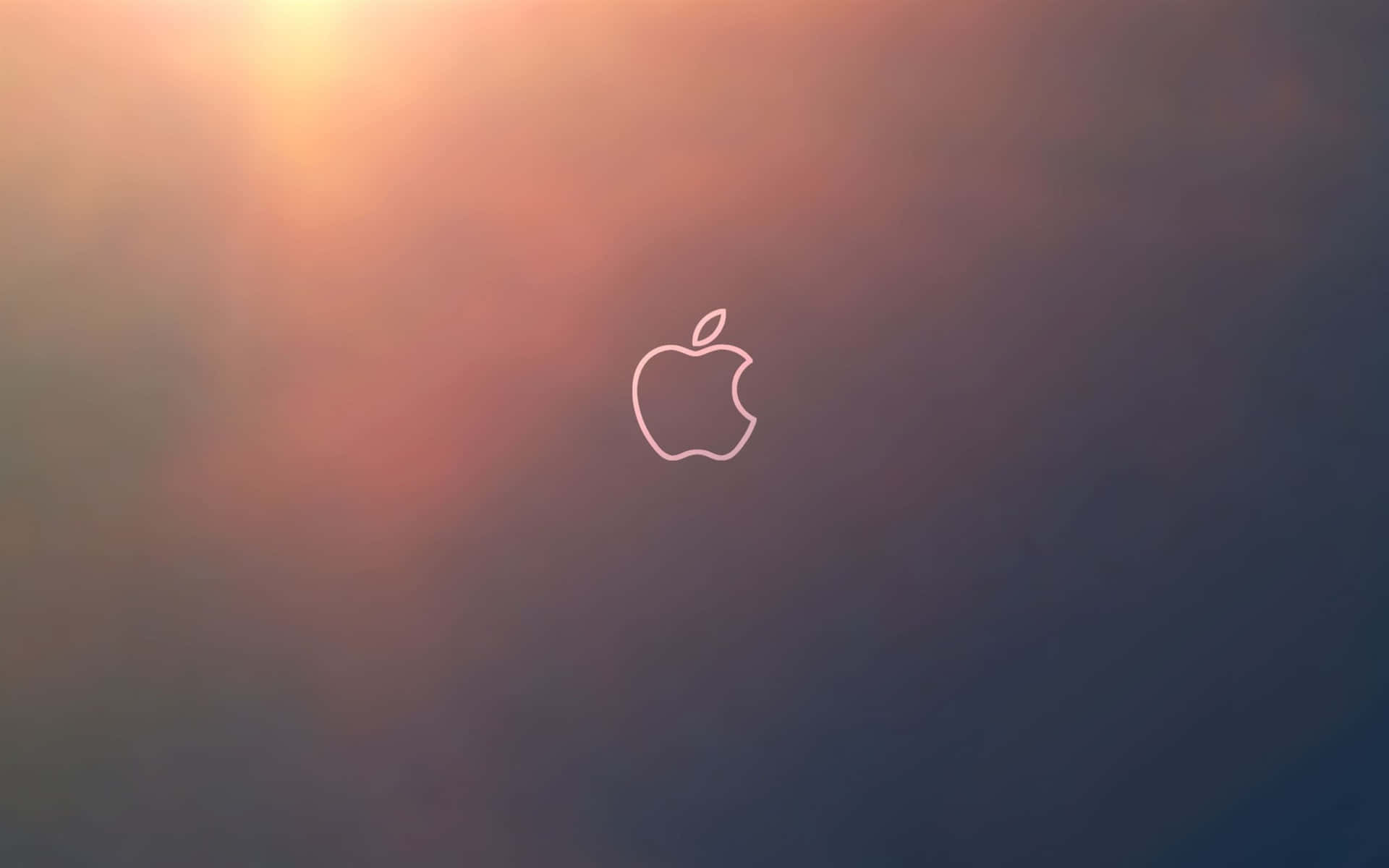 Apple標誌剪影在日落漸變背景上發光。