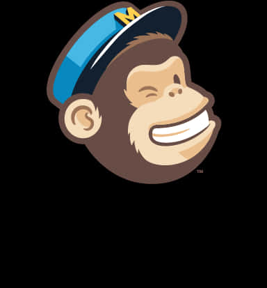 Mailchimp 吉祥物微笑猴子 壁紙 — 一隻戴著藍色帽子、上有黃色「M」字樣的開心卡通猴子，在黑色背景前咧嘴大笑。