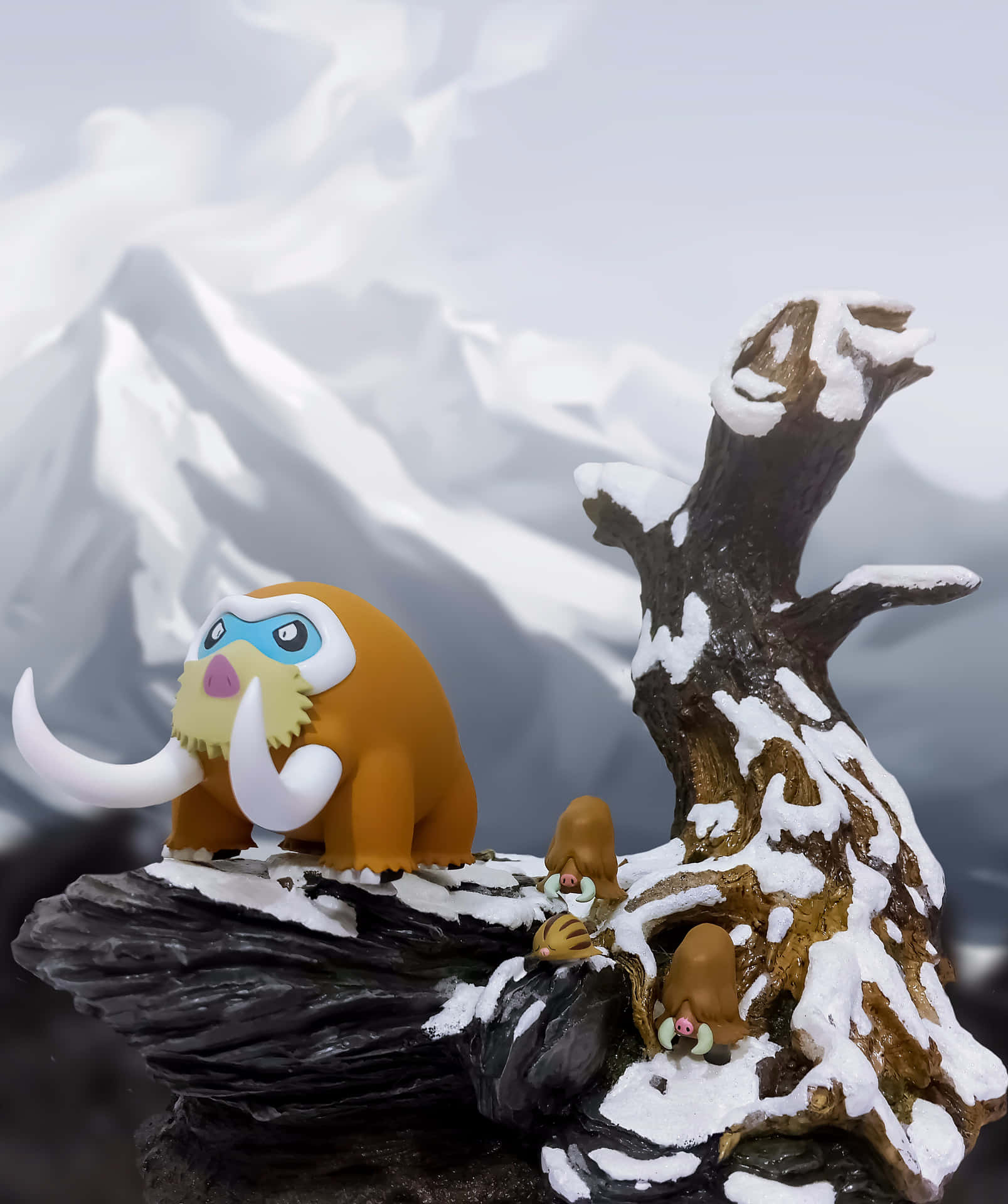 雪地山景中的海象公仔和嬰兒公仔。