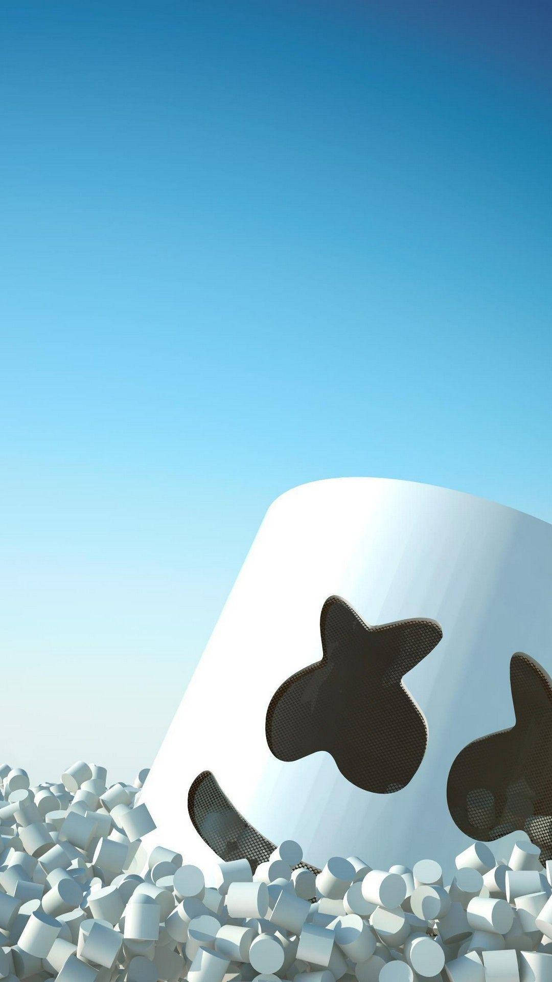 Marshmello iPhone 浮於棉花糖中 壁紙 — 一個巨大的白色棉花糖，帶有黑色星星眼睛，從一堆較小的棉花糖中冒出，背景是清澈的藍天。