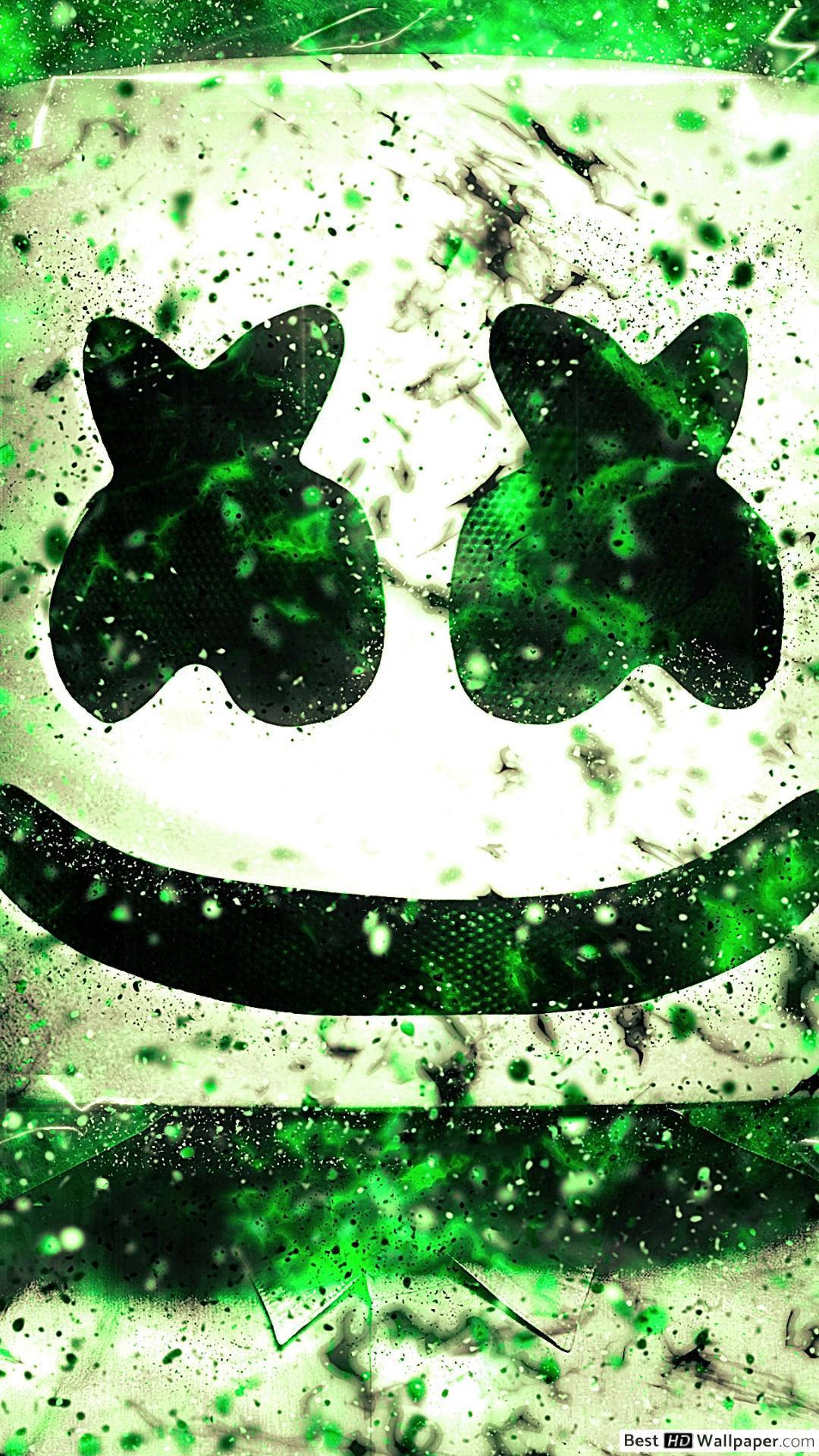 Marshmello iPhone 綠色 壁紙 — 一個風格化的綠色潑濺藝術標誌，帶有微笑的臉和貓咪般的耳朵，背景為有紋理的白色。