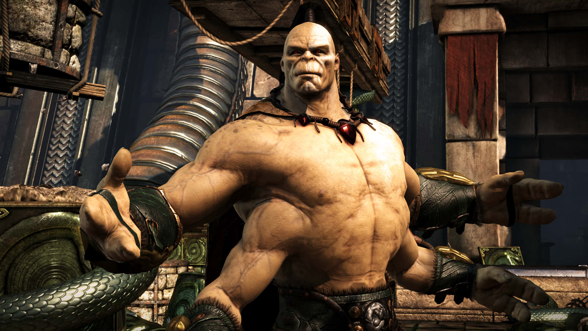 Mortal Kombat Goro 桌布 壁紙 — 一個巨大肌肉發達的獸人戰士，戴著紅色心形項鍊，站在石頭和金屬地牢中。