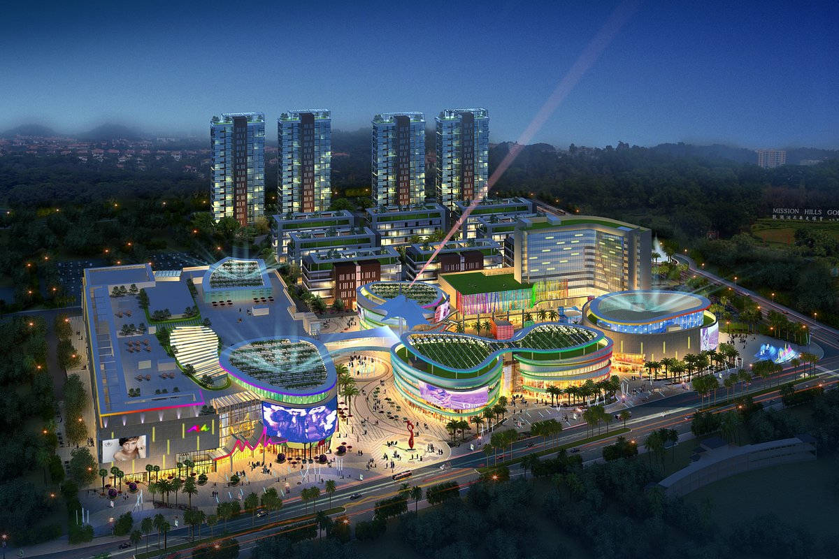 深圳MH Mall 壁紙 — 一個未來主義的城市綜合體在夜晚閃耀著霓虹燈和高聳的玻璃摩天大樓，映襯著黑暗的天空。