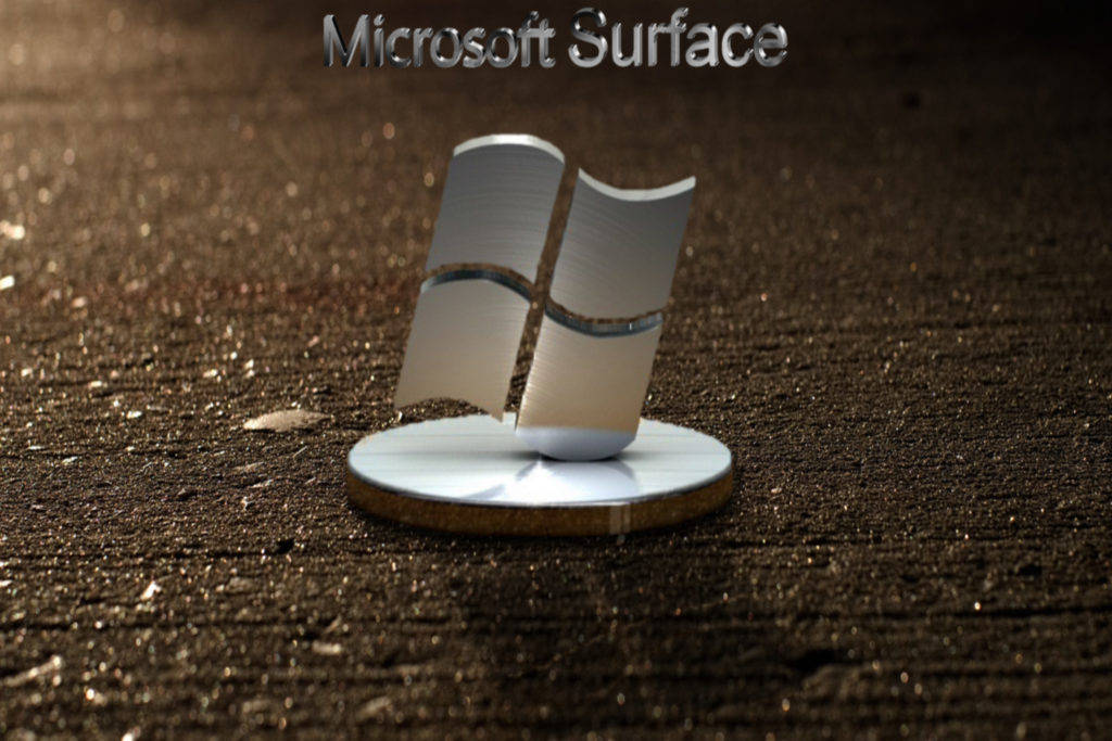 Microsoft Surface 3D 標誌 壁紙 — 一個金屬質感的Microsoft Surface標誌雕塑，立於紋理深色地面上，帶有溫暖光線和淺景深。