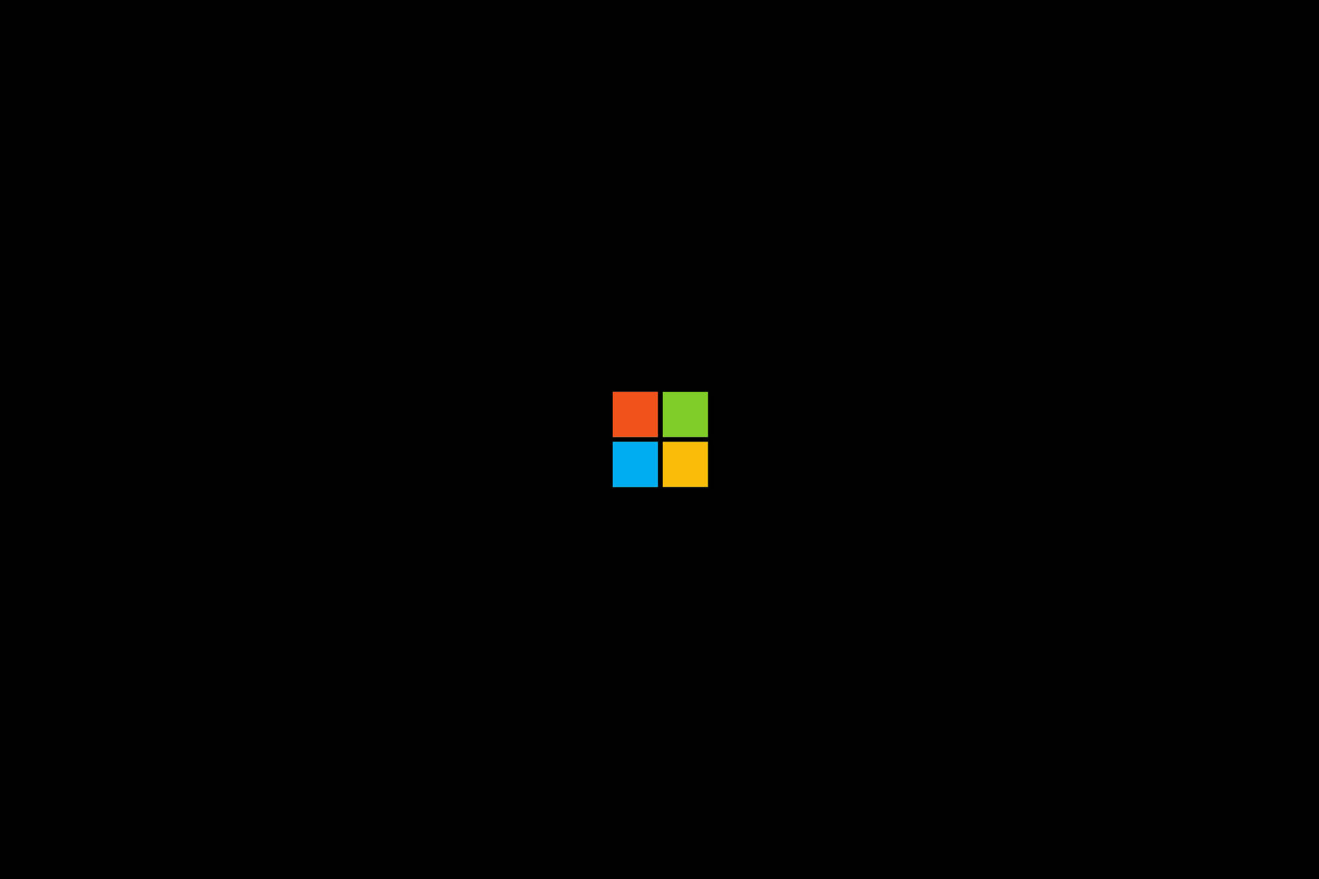 Microsoft標誌，四個彩色方塊在黑色背景上