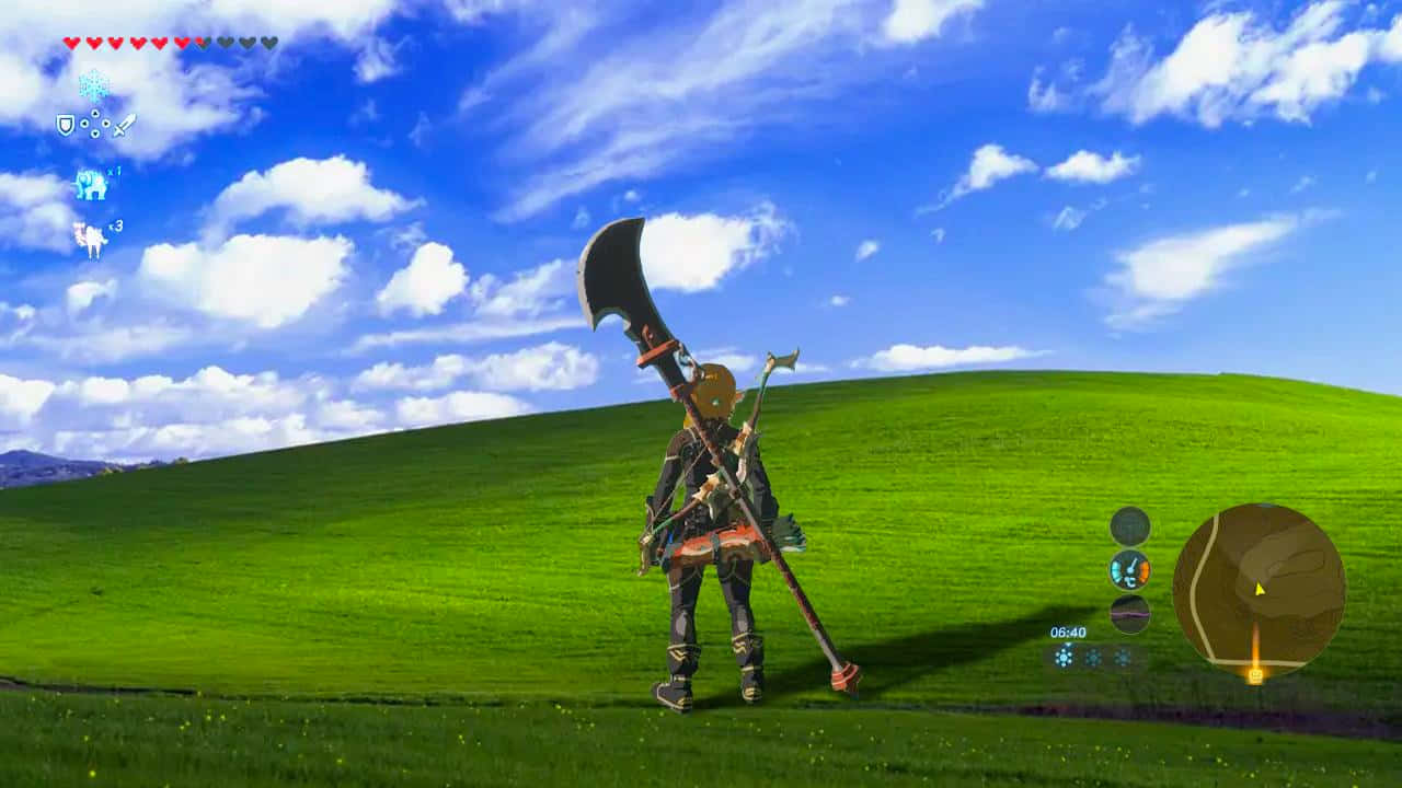 經典的 Microsoft Windows XP 操作系統 壁紙 — 一個孤獨的冒險家站在充滿活力的綠色山丘上，在點綴著蓬鬆白雲的明亮藍天下，手持一把巨大的彎曲劍。