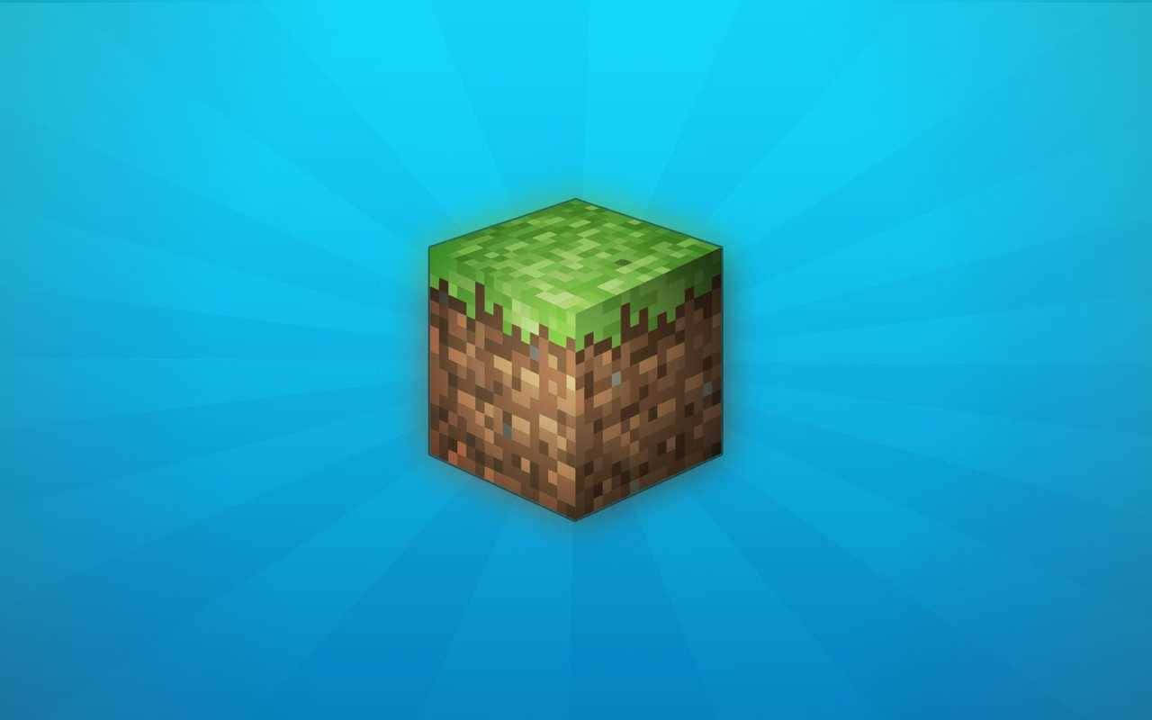 探索色彩繽紛的Minecraft世界 壁紙 — 一個來自Minecraft的像素化草地方塊漂浮在耀眼的藍色漸變背景上。