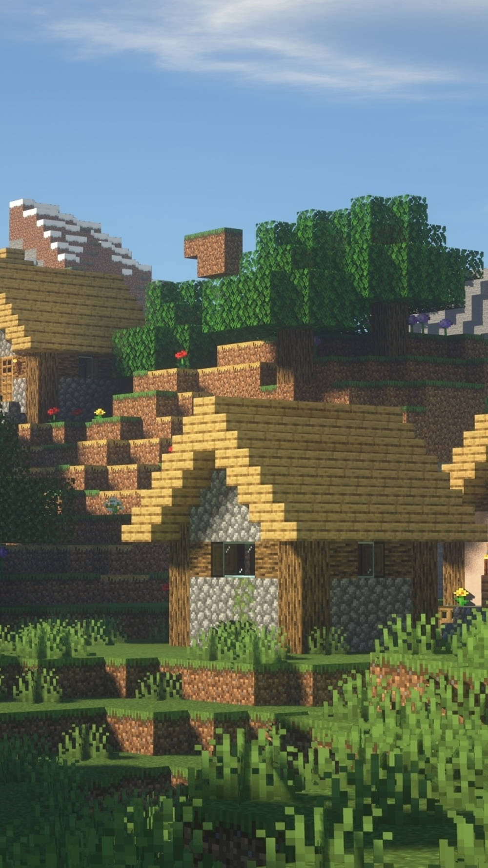 Minecraft手機棕色房屋壁紙 壁紙 — 一個像素化的Minecraft村莊，有木屋、石頭地基和綠樹，在晴朗的藍天下。