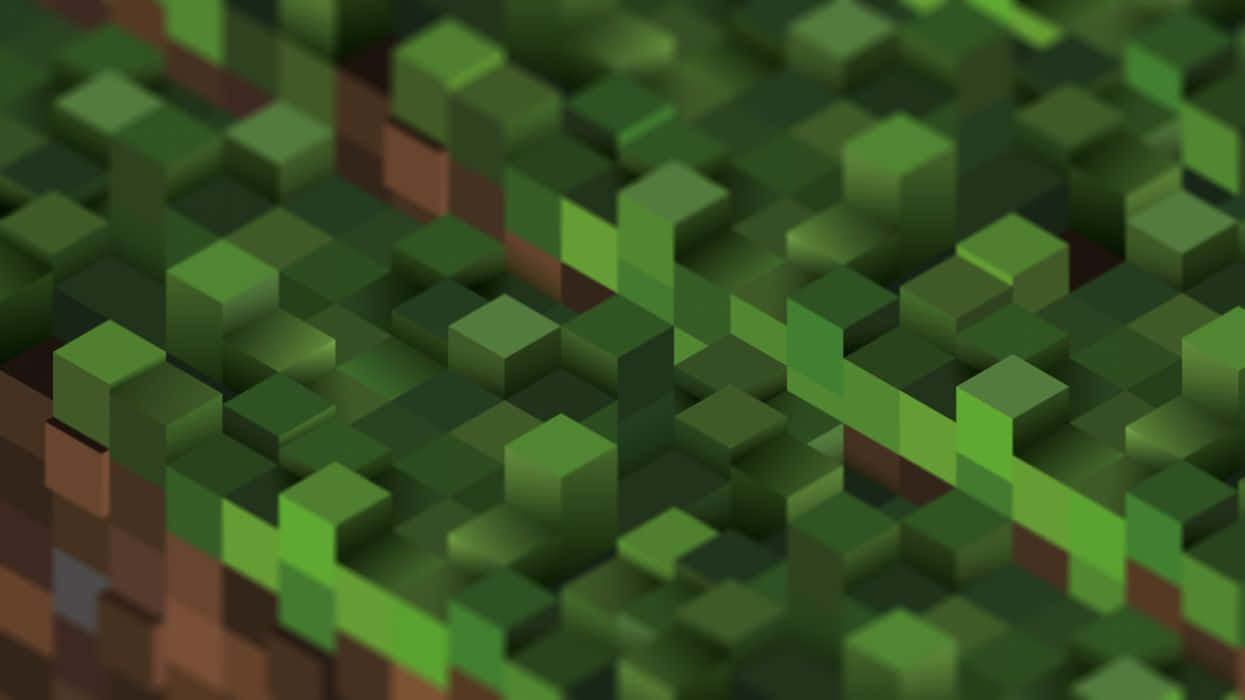 Minecraft遊戲中的草塊圖像 壁紙 — 像素化景觀的特寫，綠色方塊形成草地，棕色方塊形成土壤，呈現方塊狀的數碼風格。