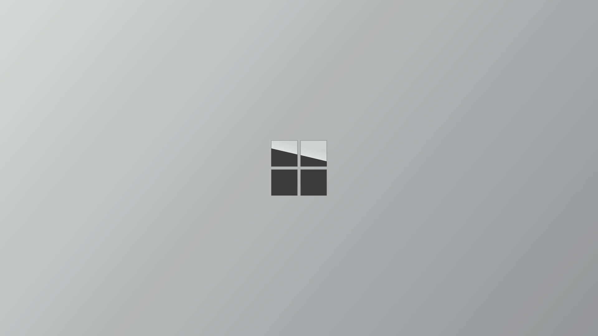  壁紙 — 一個極簡的Windows標誌居中放置在柔和的漸變灰色背景上，帶有對角線光條。