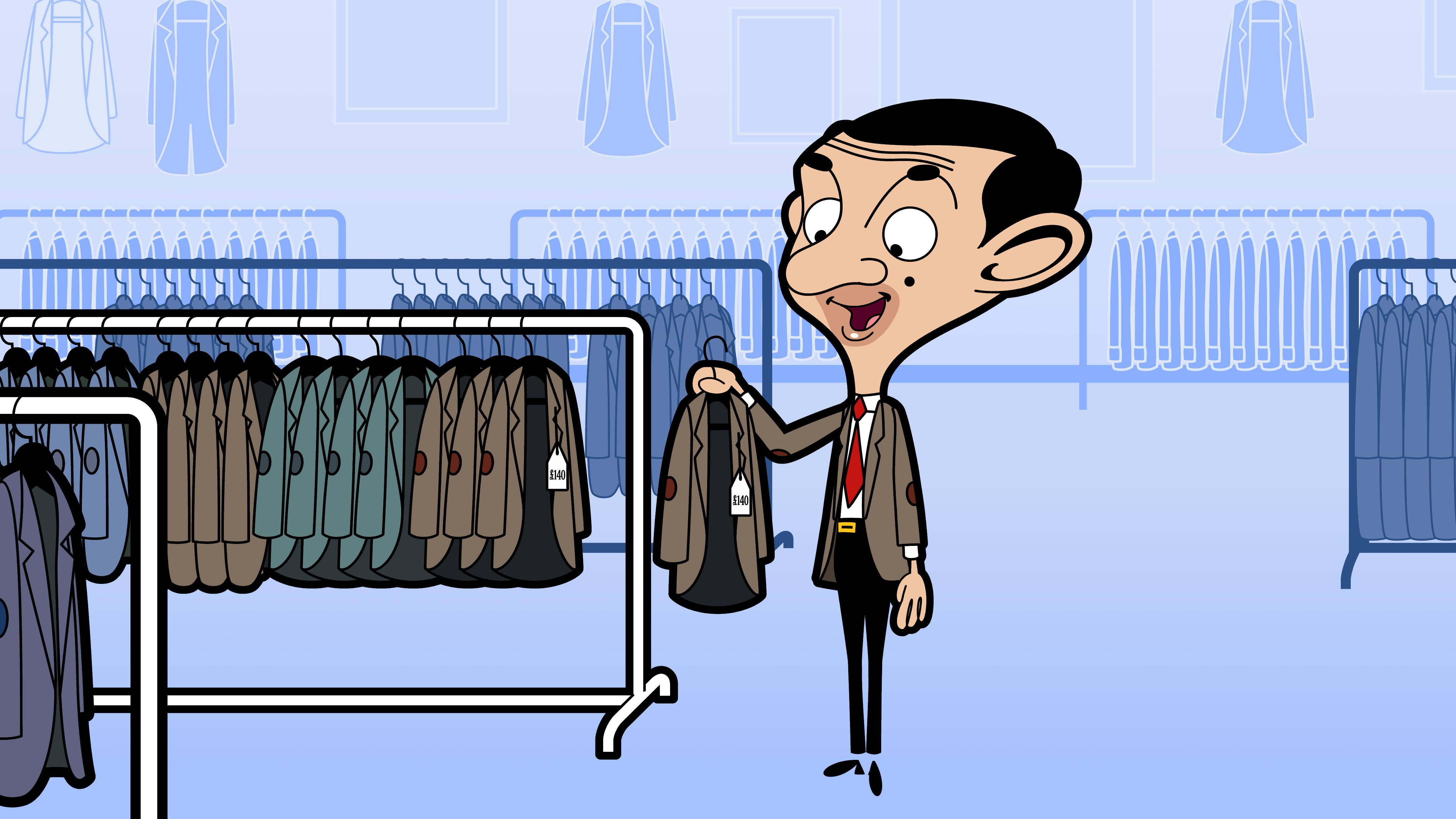 4K 桌布 壁紙 — Mr Bean 開心地在簡約服裝店裡拿著一件外套，店內有西裝架。