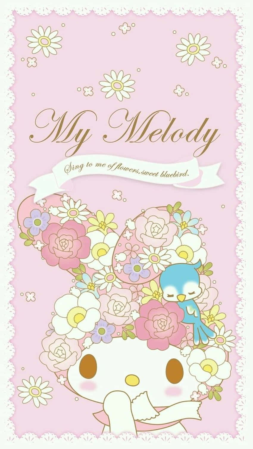 My Melody 戴花環頭飾 壁紙 — My Melody，一隻白兔，棕色眼睛，戴著花冠，一隻藍色小鳥棲息在花冠上，背景為粉紅色，帶有蕾絲邊框。