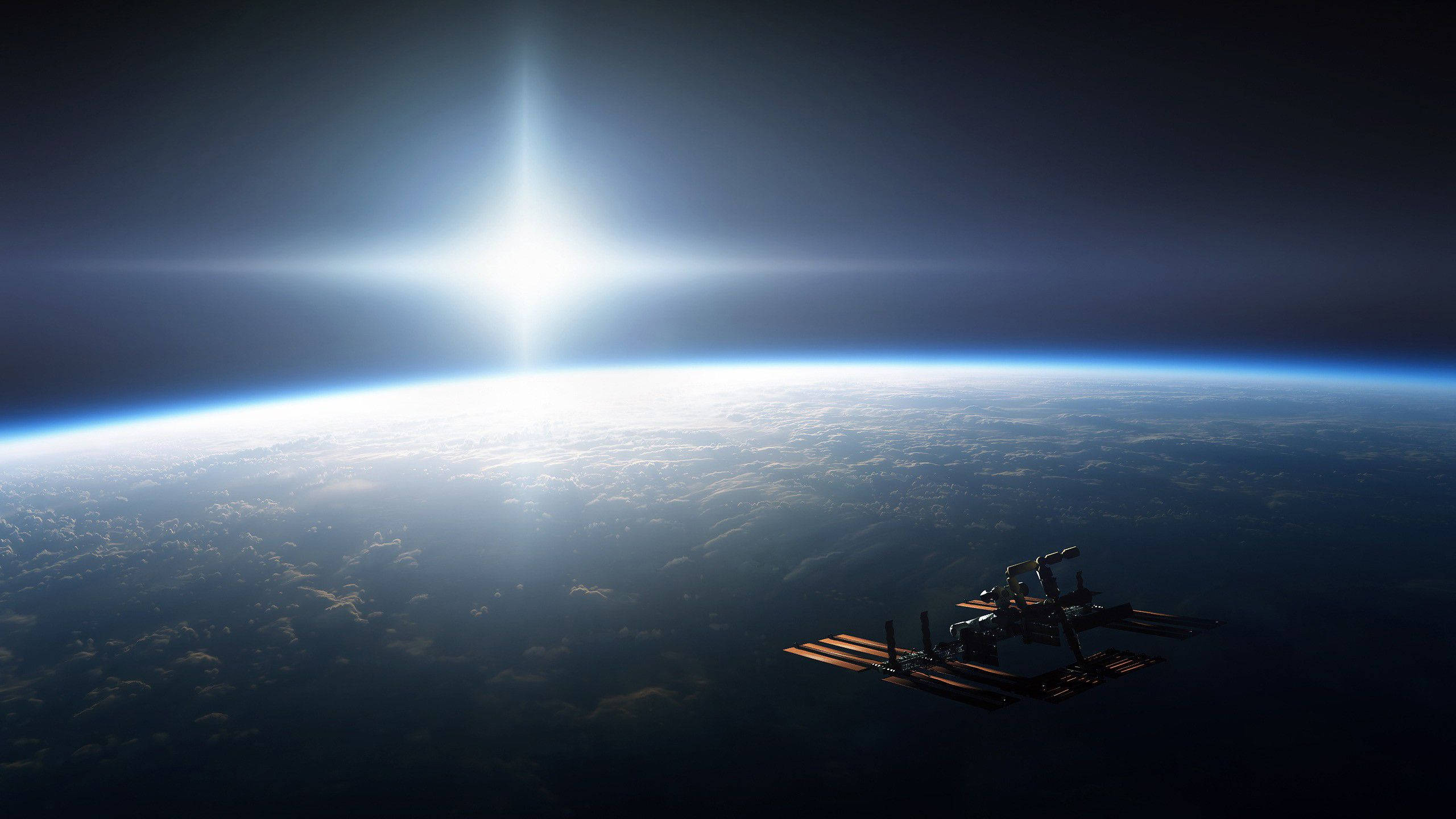 NASA明亮星光 壁紙 — 一個太空站繞地球運行，太陽在行星彎曲的地平線上方明亮地照耀。