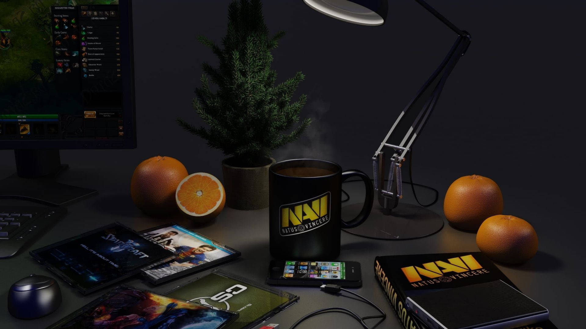 Natus Vincere 桌面風景 壁紙 — 燈光昏暗的遊戲桌上放著冒煙的杯子、橙子、小樹和顯示遊戲的顯示器。