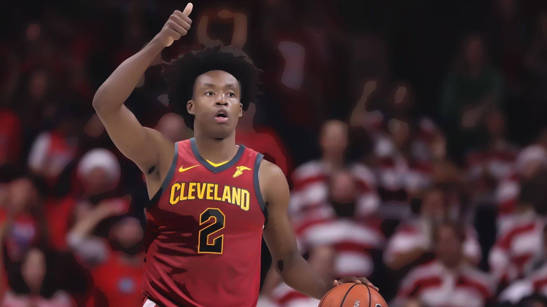 NBA克里夫蘭隊科林·塞克森 壁紙 — 一位身穿紅色二號球衣的克里夫蘭騎士隊籃球運動員在比賽中舉起拇指，同時拿著球。