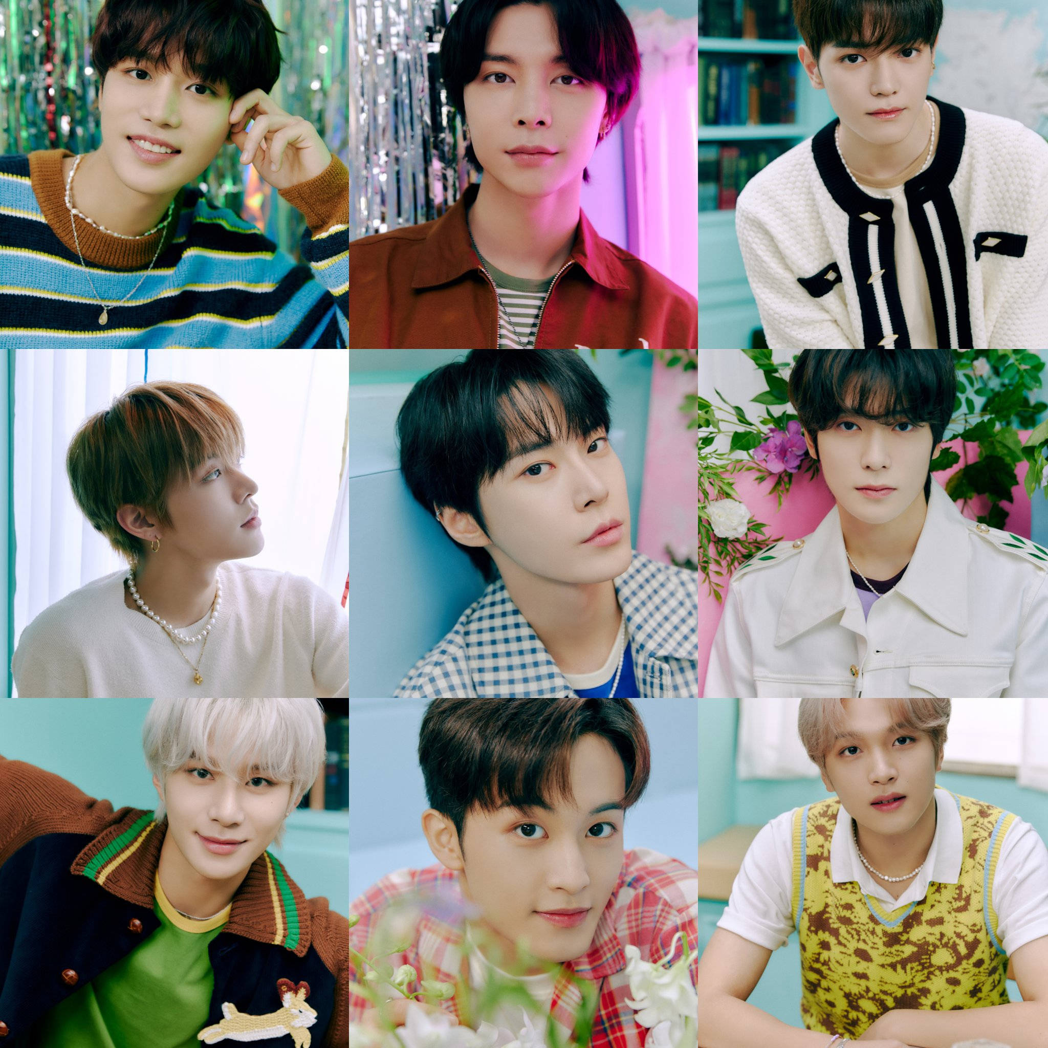 NCT 127《Dreamer》預告照 壁紙 — 九位年輕男子身穿色彩繽紛的服裝，在充滿花卉和閃亮元素的鮮豔背景前擺姿勢。
