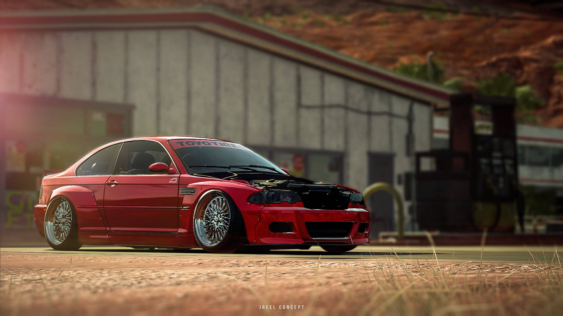 《Need For Speed Payback》紅色BMW M3 E46 壁紙 — 一輛鮮紅色改裝跑車，引擎外露，低趴於定制輪圈上，停在一座風化的工業建築前。