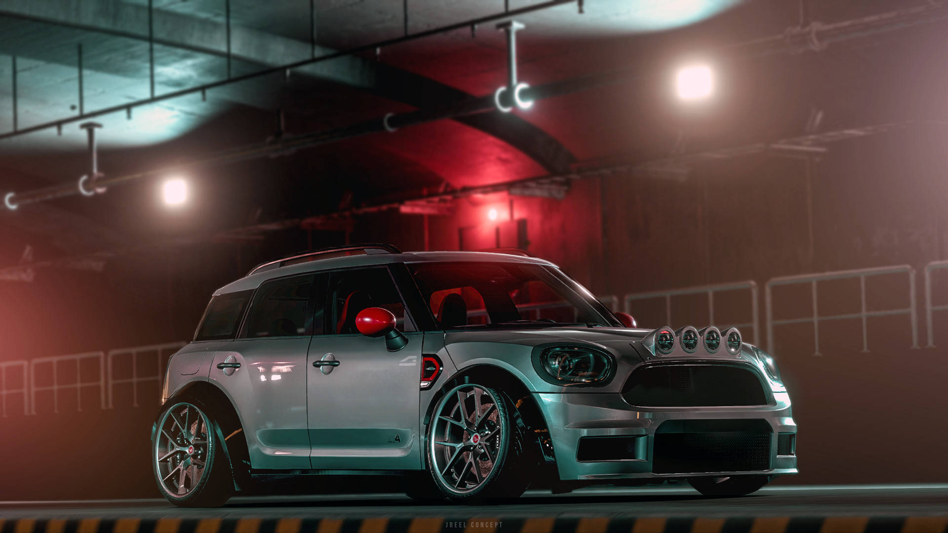《Need for Speed Payback》銀色Countryman 壁紙 — 一輛銀色MINI Cooper，帶有紅色點綴和定制車燈，停在光線昏暗的工業車庫中，車庫內有紅色和藍綠色燈光。