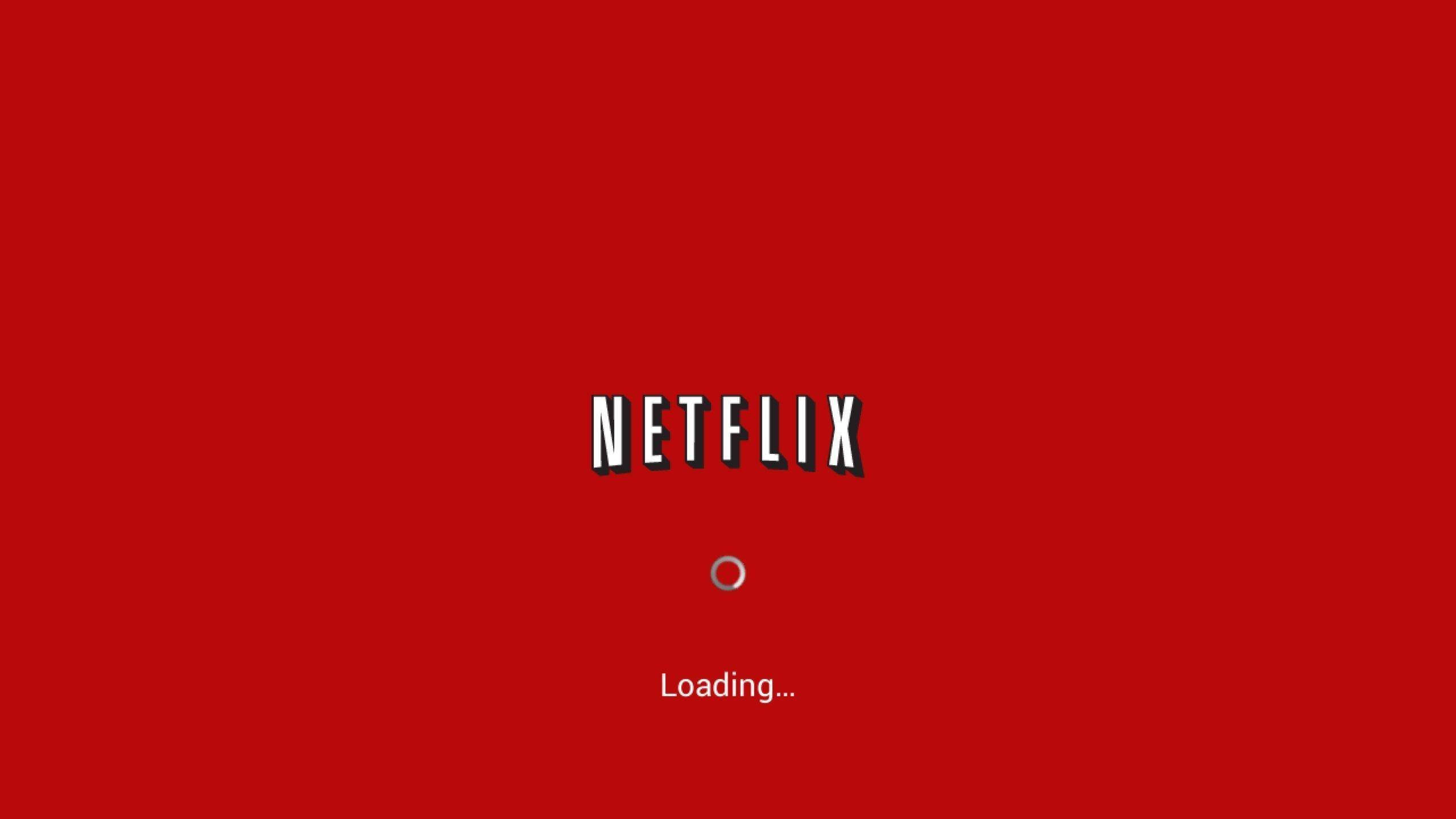 Netflix無限串流娛樂 壁紙 — 一個大膽的紅色Netflix加載畫面，白色標誌和旋轉圓圈居中在純色背景上。