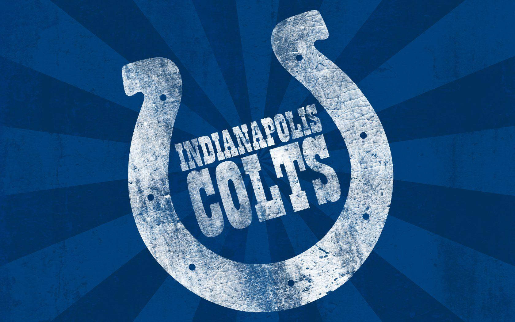 NFL印第安納波利斯小馬隊圖像設計 壁紙 — 一個風化的印第安納波利斯小馬隊馬蹄鐵標誌以白色呈現，在帶有紋理的藍色放射狀背景上格外突出。