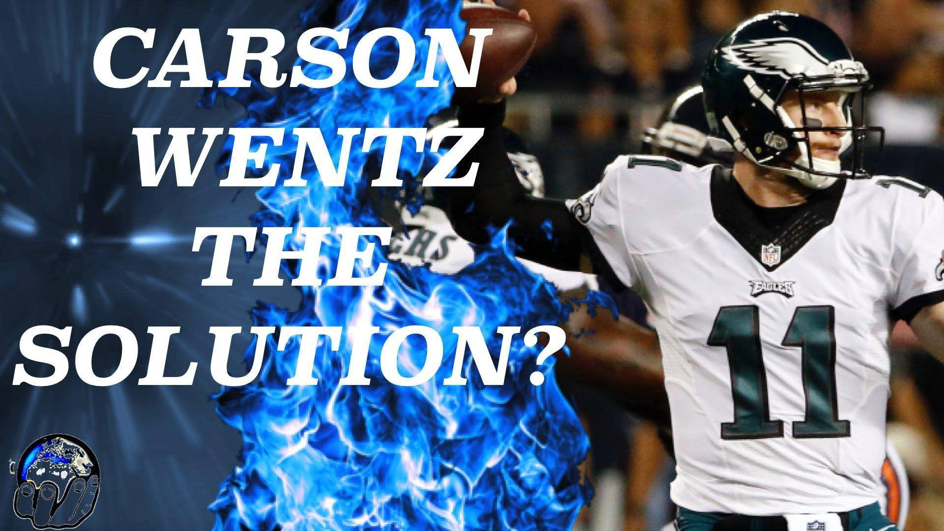 NFL第11號四分衛卡森·溫茲 壁紙 — 身穿白色球衣的足球四分衛 Carson Wentz 被藍色火焰包圍，粗體文字詢問他是否解決方案。