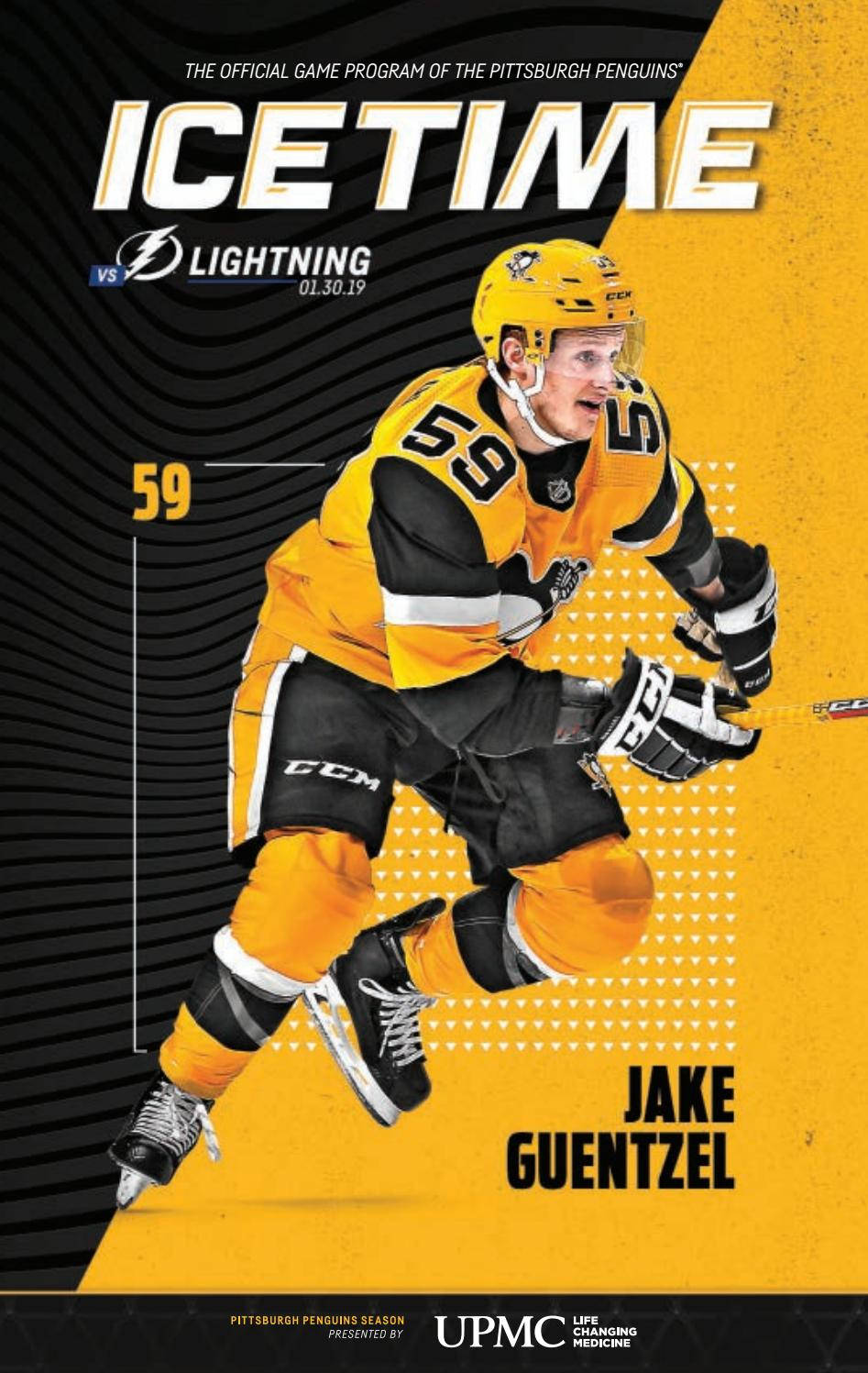 冰球運動員 Jake Guentzel 身穿匹茲堡企鵝隊制服比賽中。