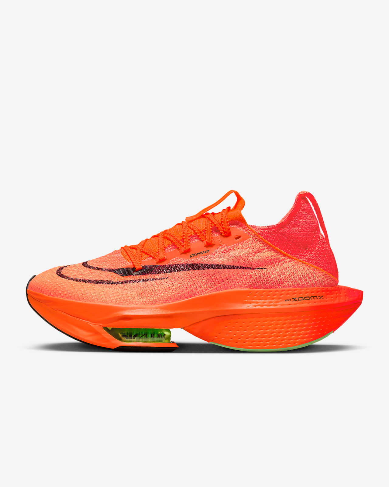 充滿活力的橙色Nike ZoomX跑鞋，帶綠色緩震單元。