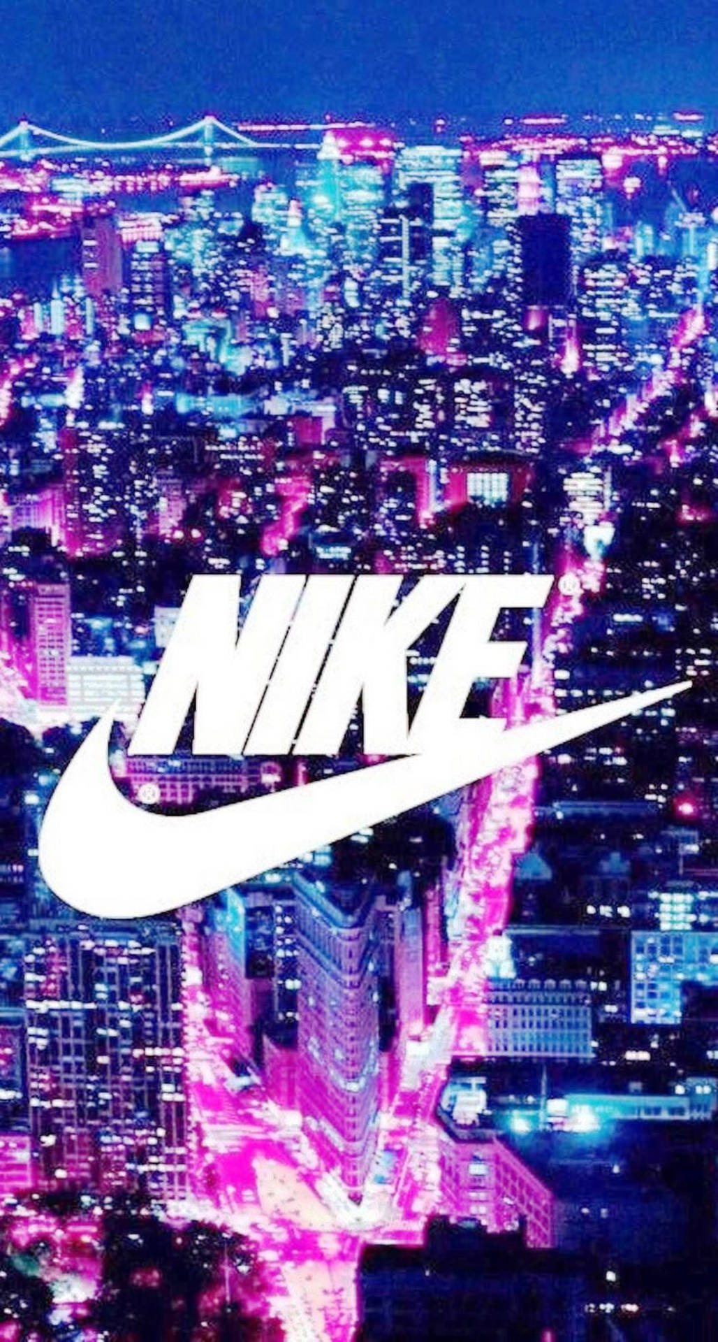 Nike標誌在夜晚發光的霓虹城市上空 — 粉紅色 iPhone 壁紙