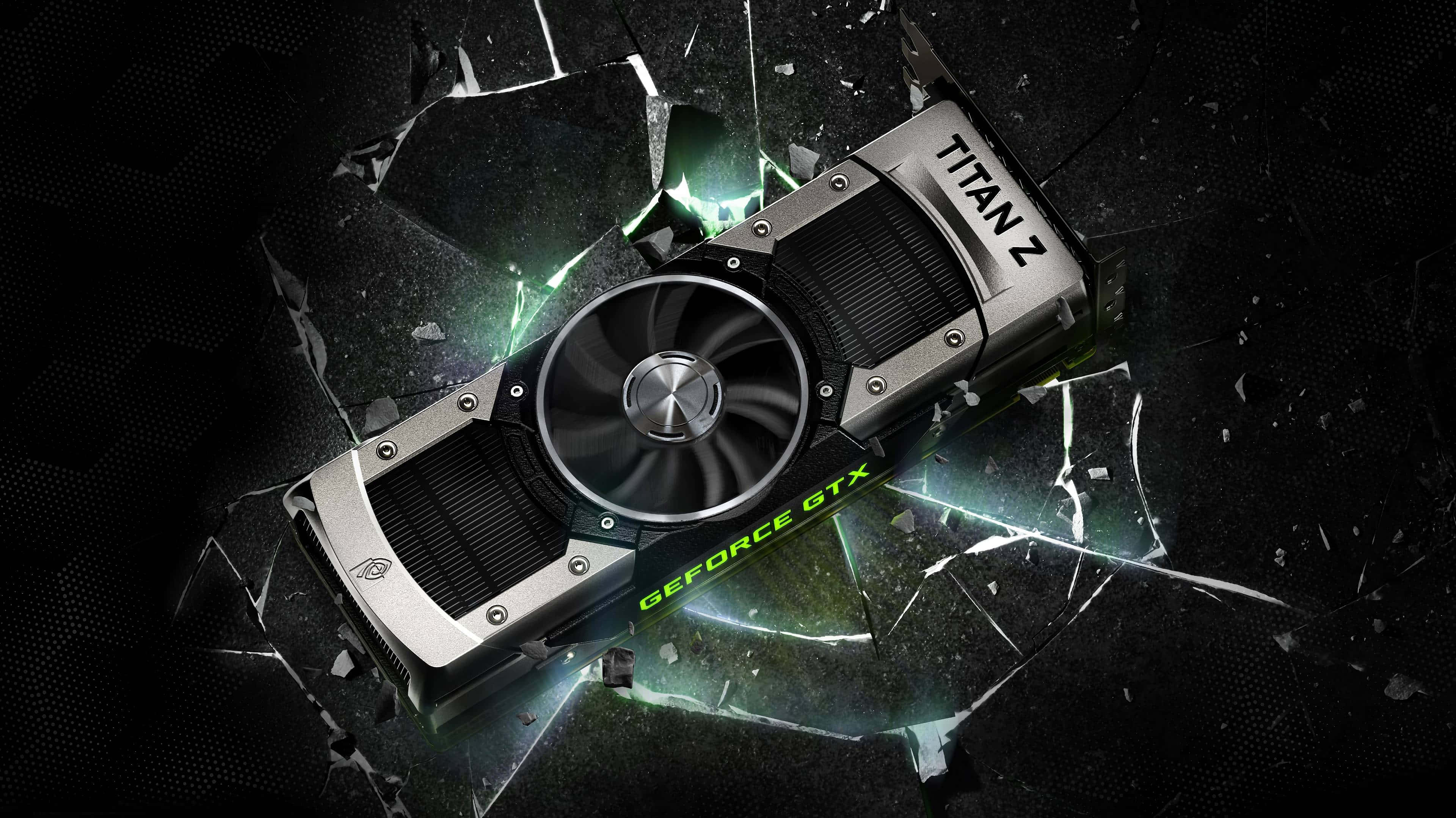 NVIDIA 4K UHD GeForce GTX TITAN 壁紙 — Nvidia GeForce GTX Titan Z 顯示卡在黑暗背景下以發光的綠色能量擊碎玻璃。