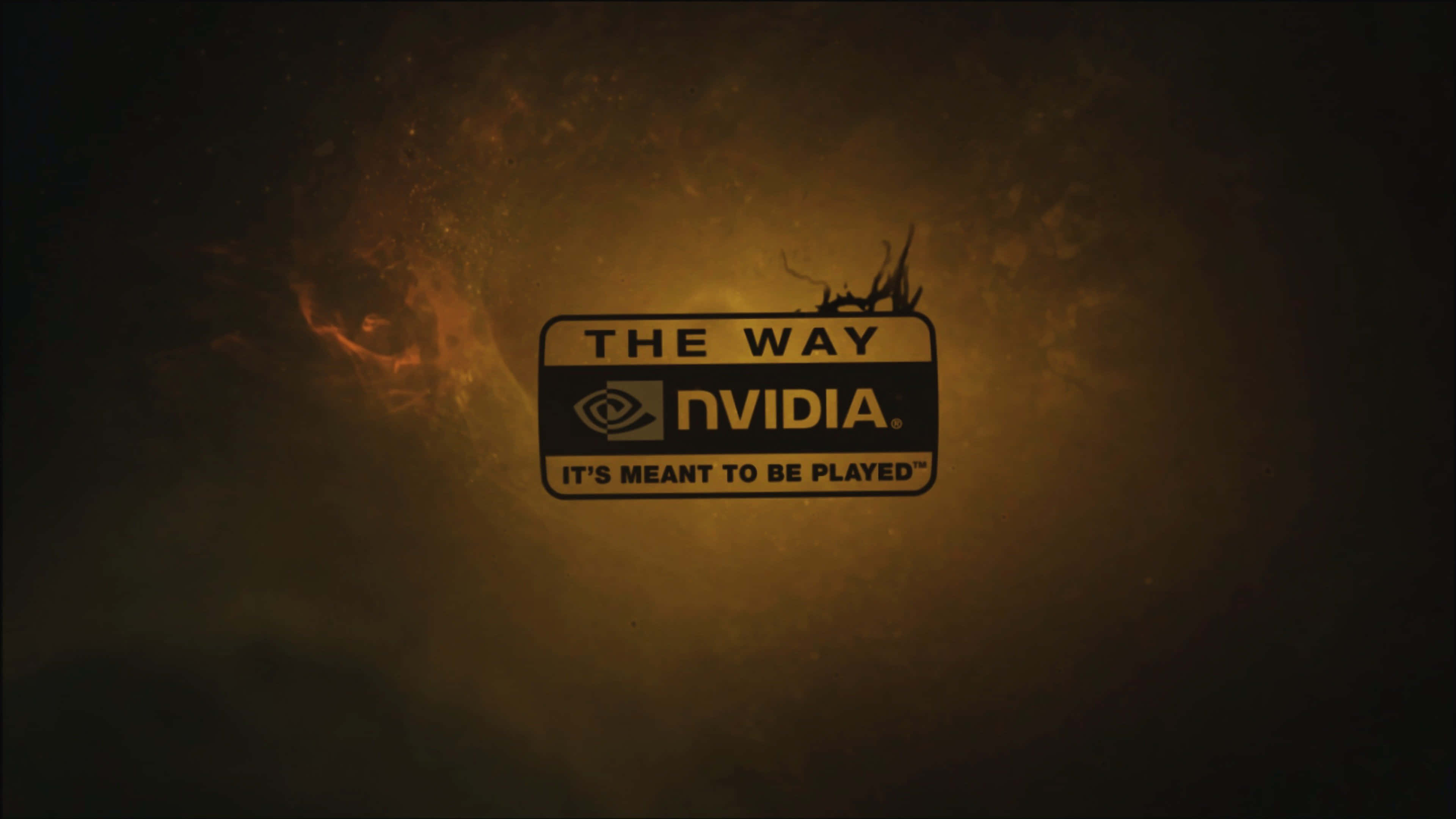NVIDIA 4K UHD品牌口號 壁紙 — Nvidia 標誌在煙霧繚繞的火熱背景中溫暖發光，附有標語「The Way It's Meant to Be Played」。