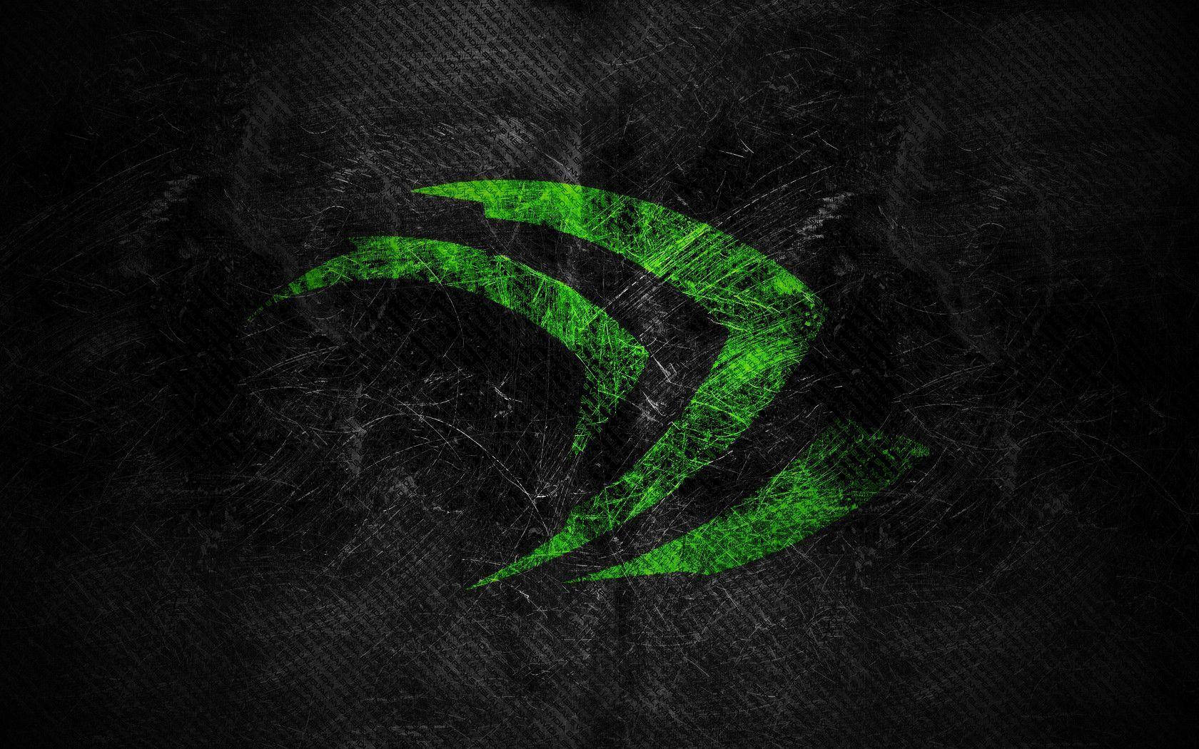 發光綠色NVIDIA標誌在刮痕黑色背景上。