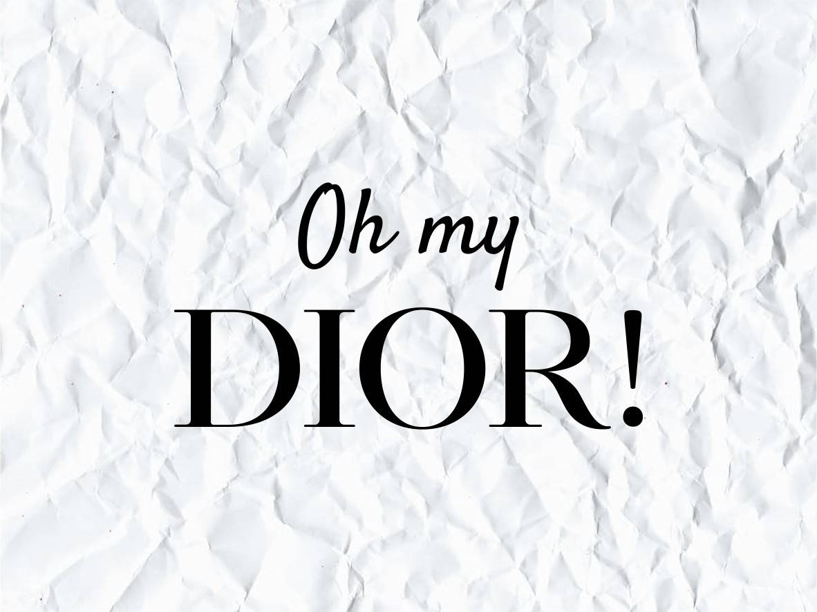 在皺巴巴的白色紙張背景上顯示「Oh my DIOR」的文字圖形。