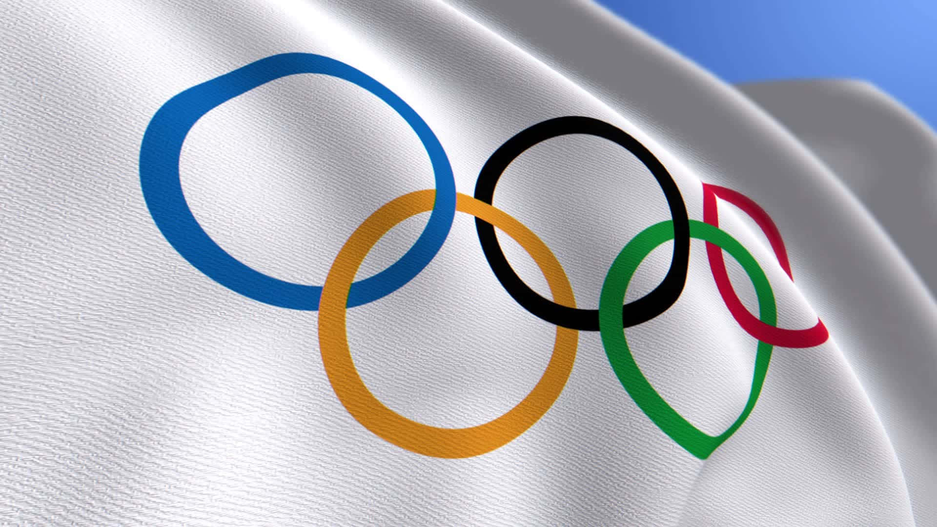 奧運五環在藍天下於白色旗幟上飄揚