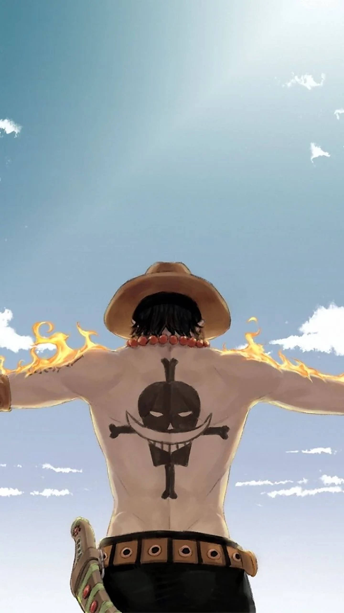 路飛燃燒 One Piece iPhone 壁紙 — 一個肌肉發達的動漫角色，戴著草帽，頭髮像火焰一樣，在明亮的藍天下張開雙臂，展示背部的紋身。
