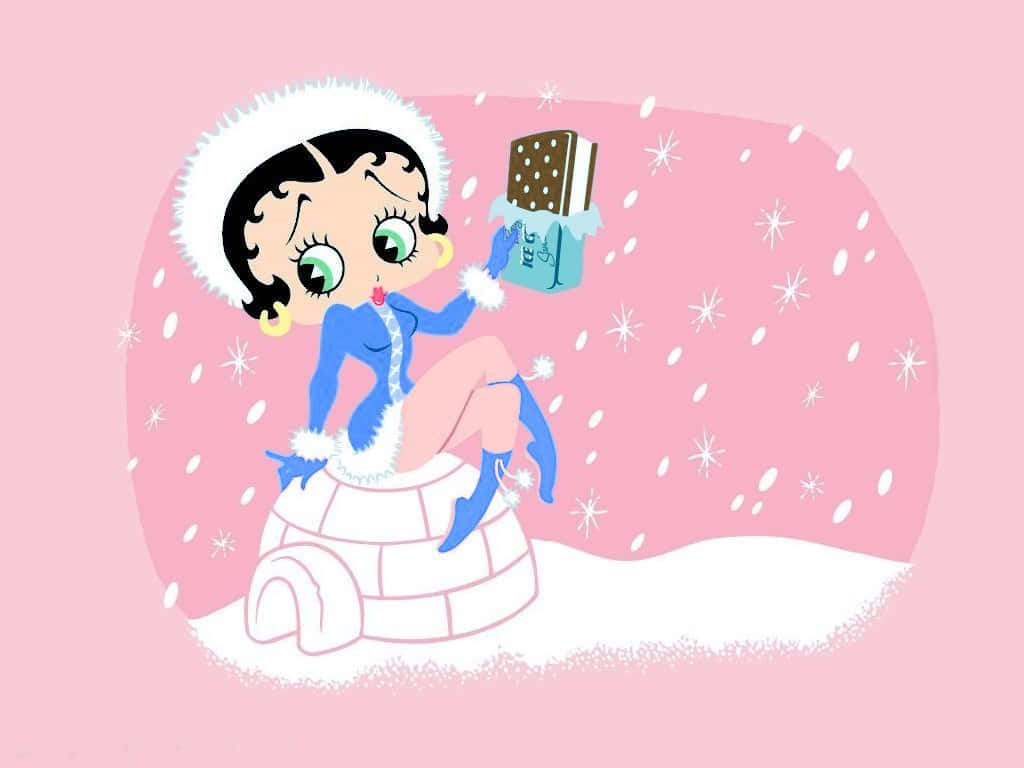 經典貝蒂·布oop展現復古風華！ 壁紙 — Betty Boop 身穿藍色冬季服裝坐在冰屋頂上，手持冰淇淋三明治，雪花在粉紅色背景中飄落。