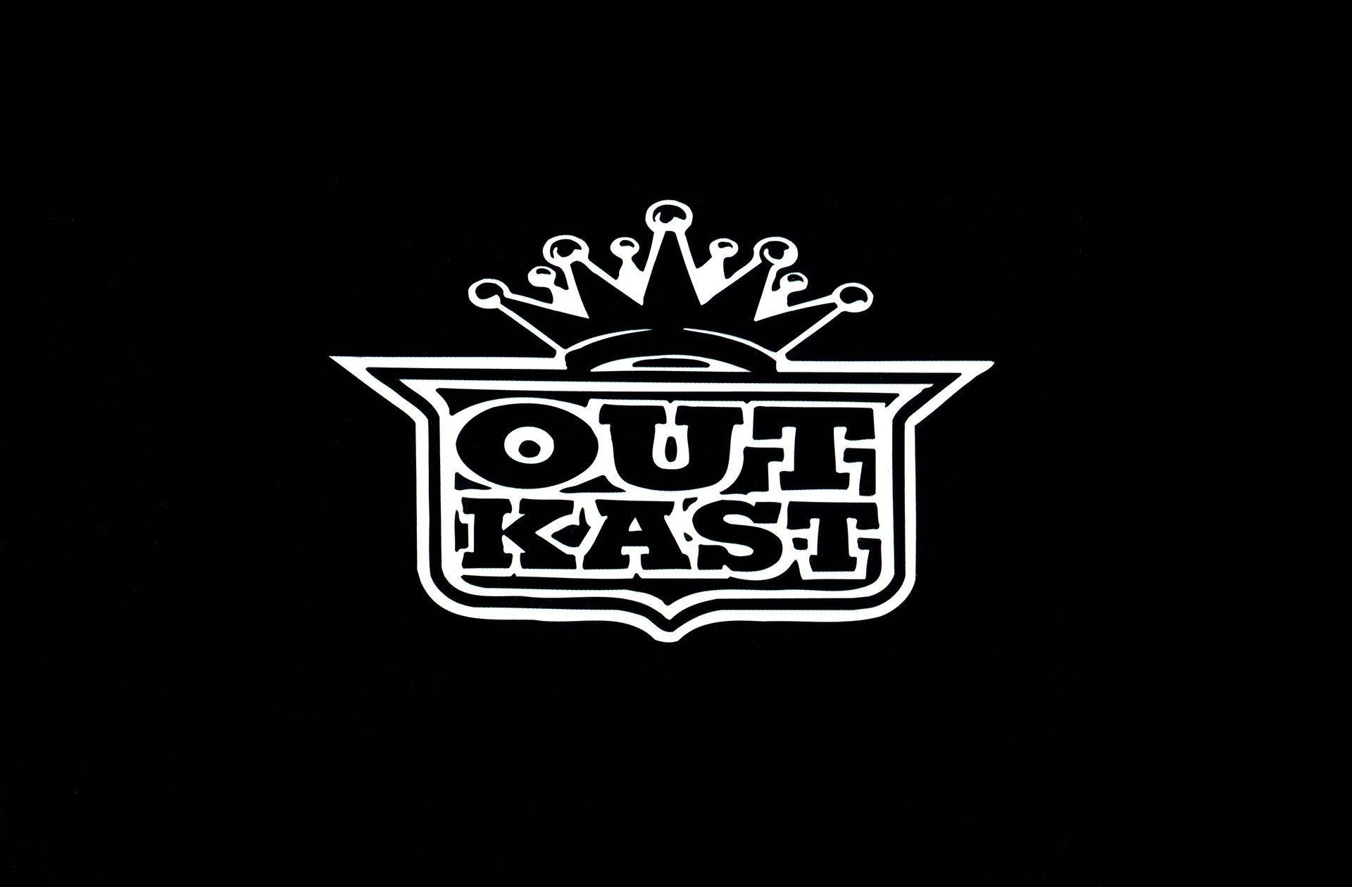 白色OutKast標誌帶皇冠在黑色背景上